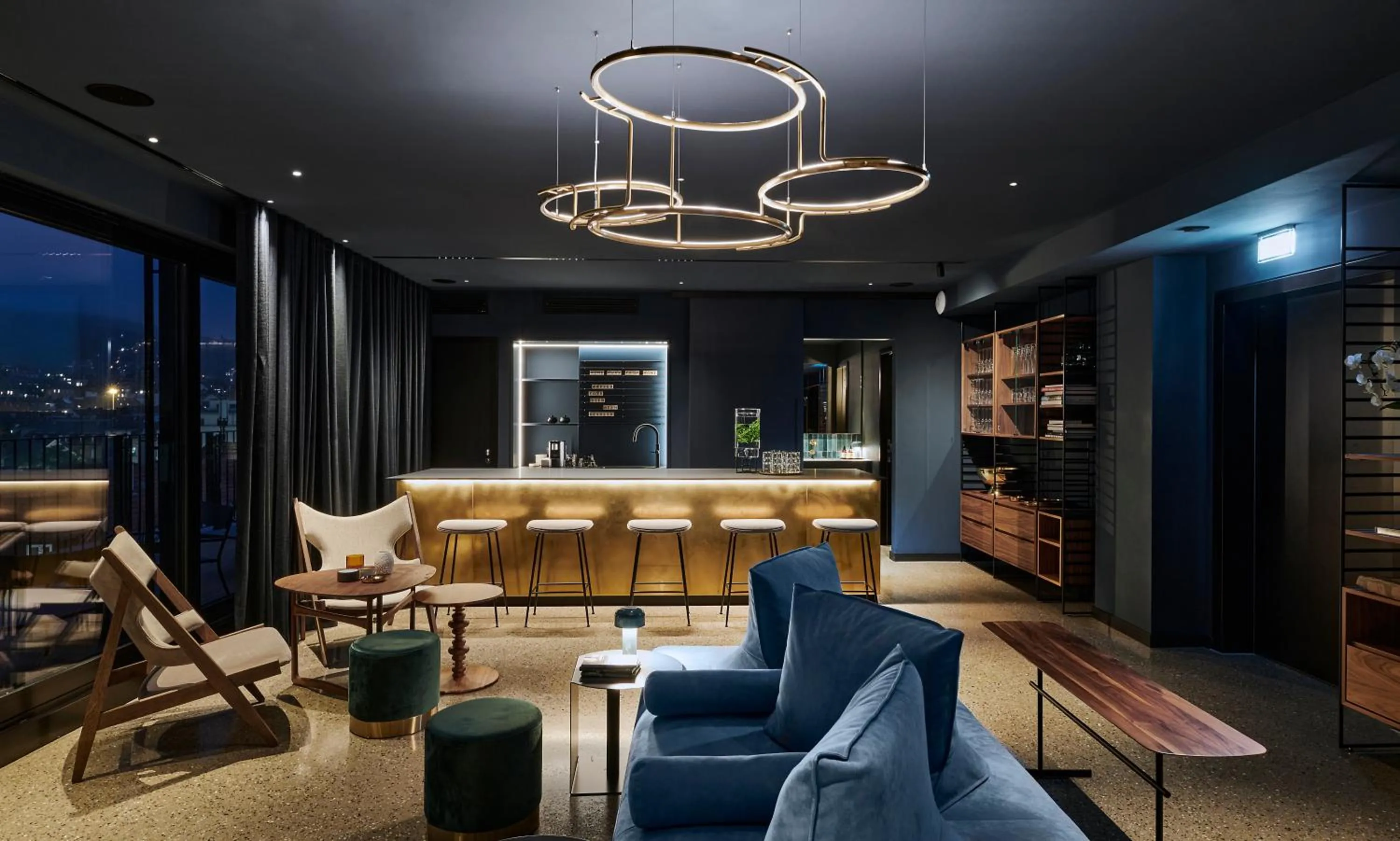 Communal lounge/ TV room in EmiLu Design Hotel