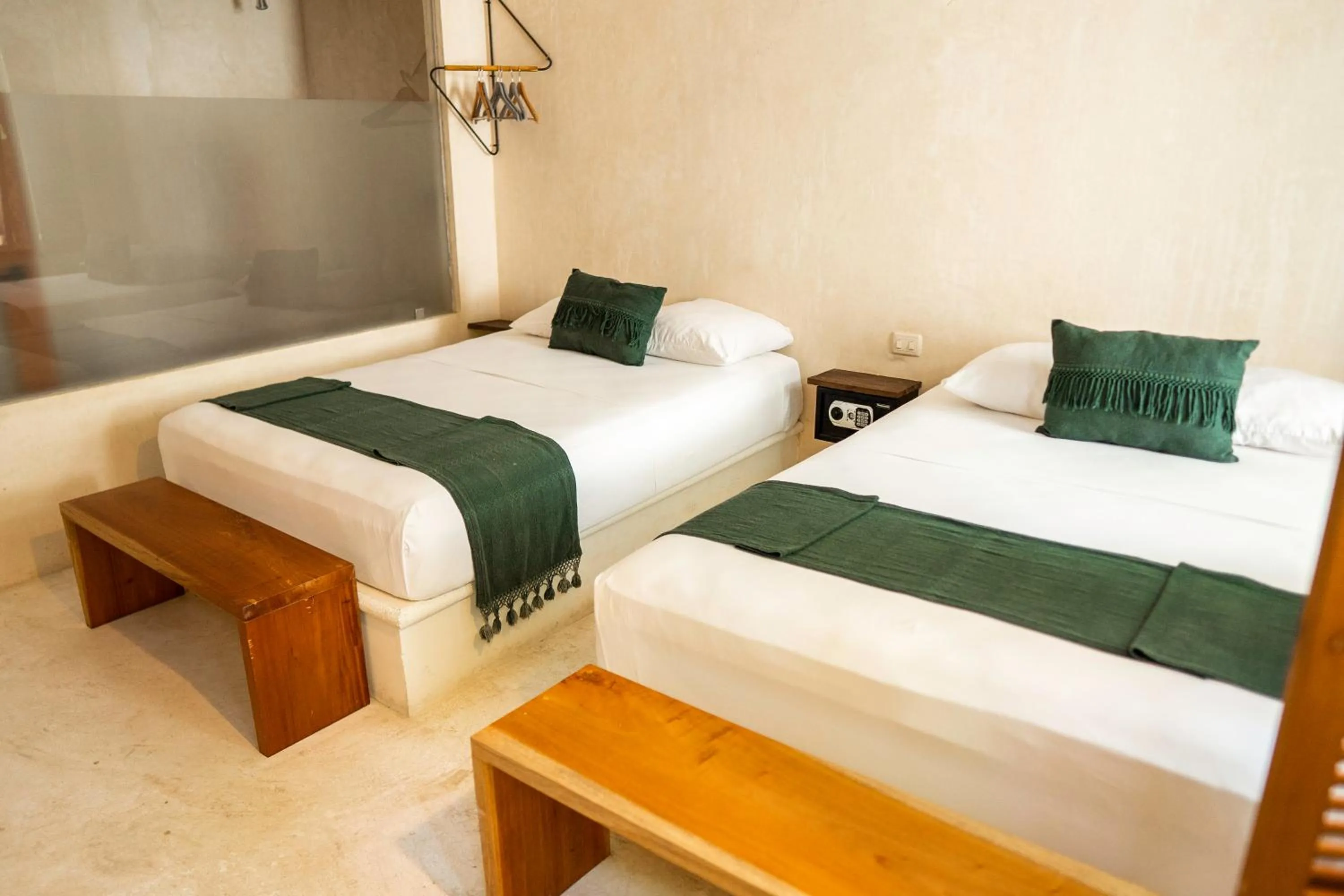 Photo of the whole room, Bed in Koos Tulum Hotel