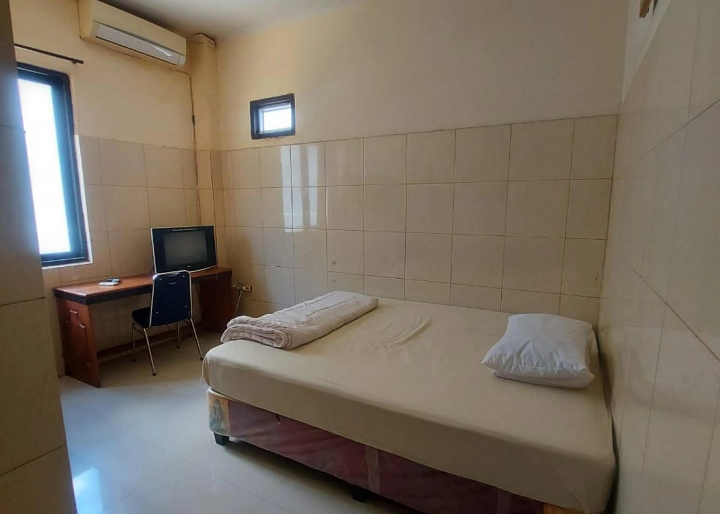 Bed in Hotel Mulia Kendari Mitra RedDoorz