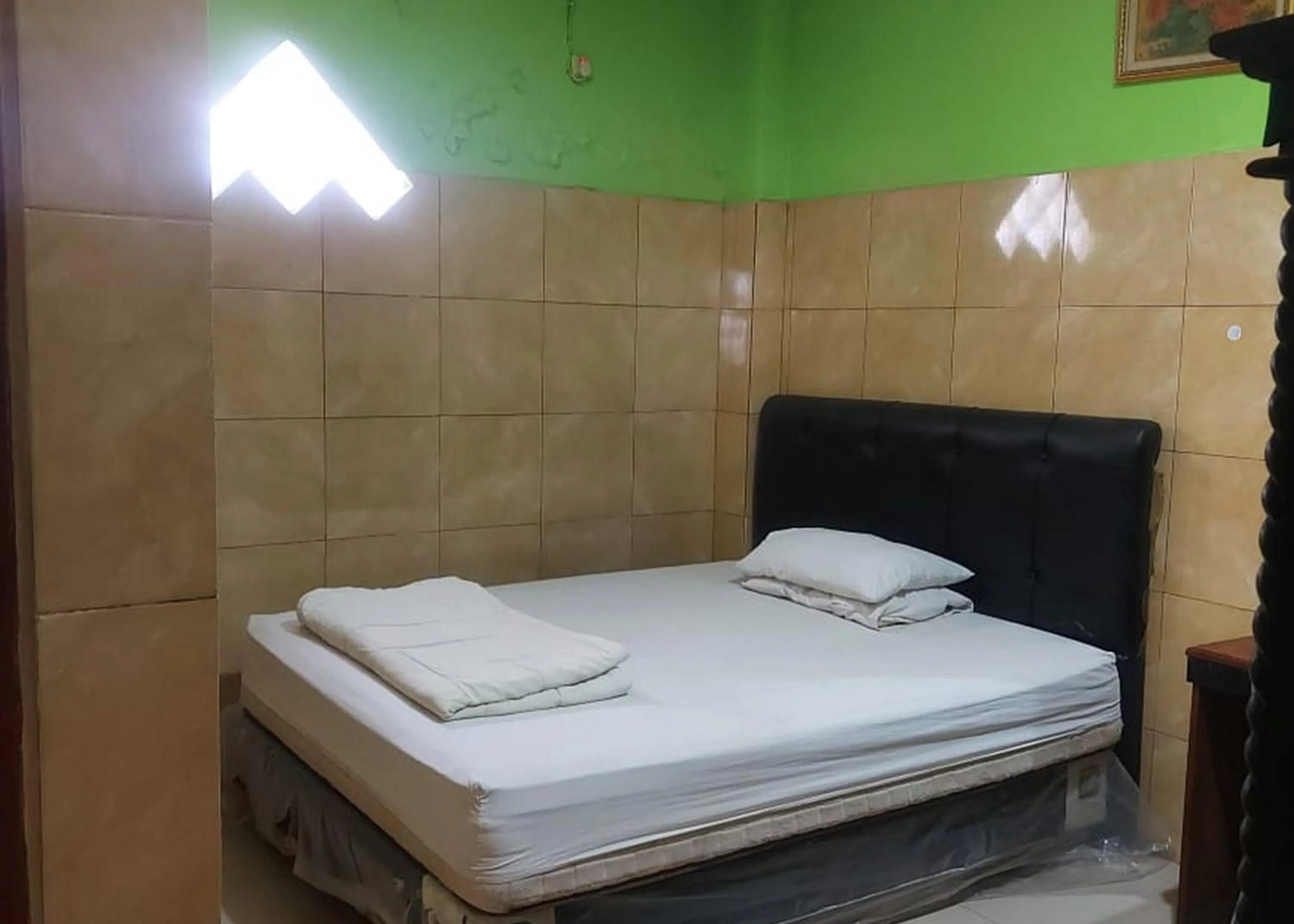 Bed in Hotel Mulia Kendari Mitra RedDoorz