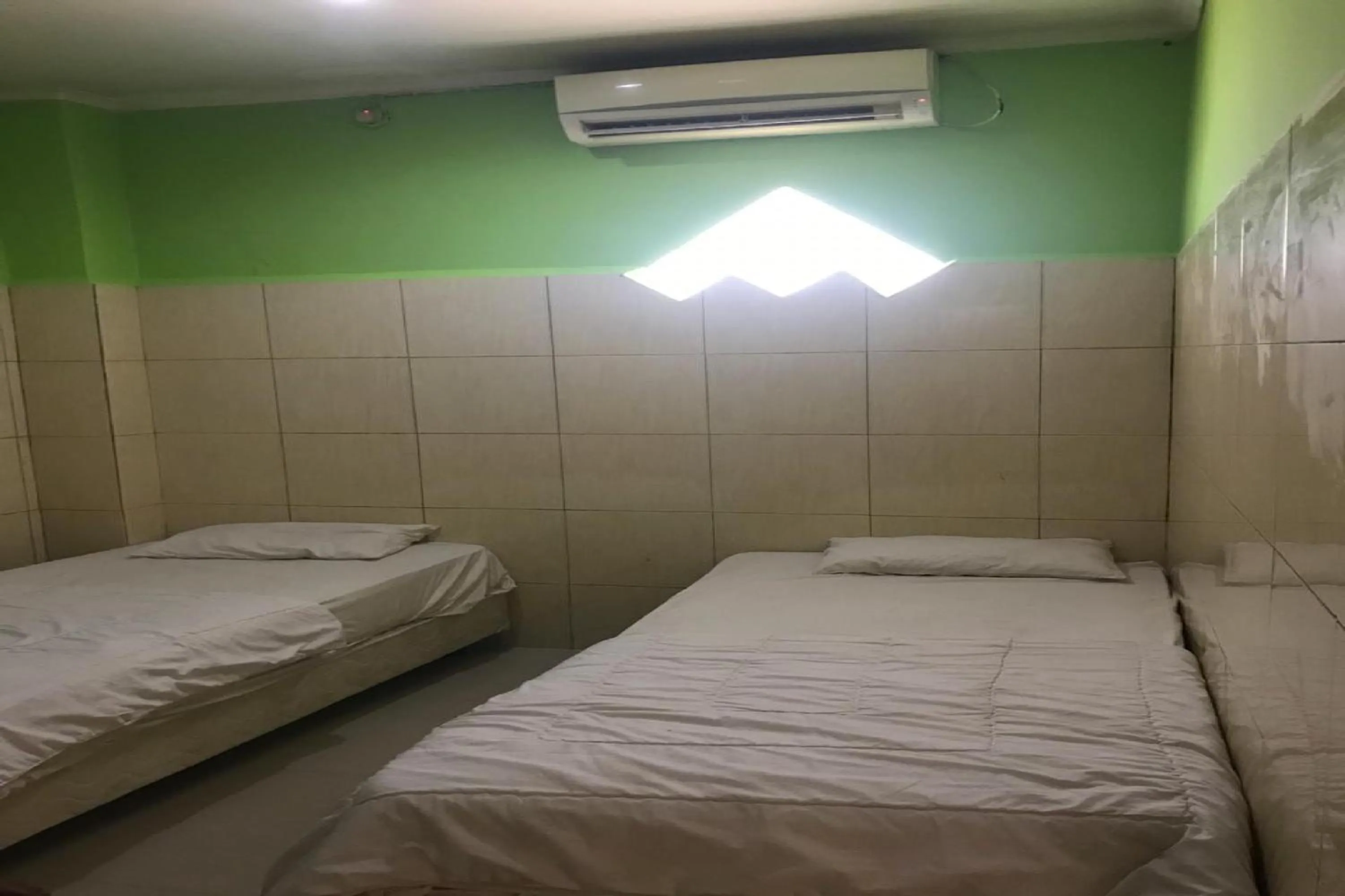 Bedroom, Bed in Hotel Mulia Kendari Mitra RedDoorz