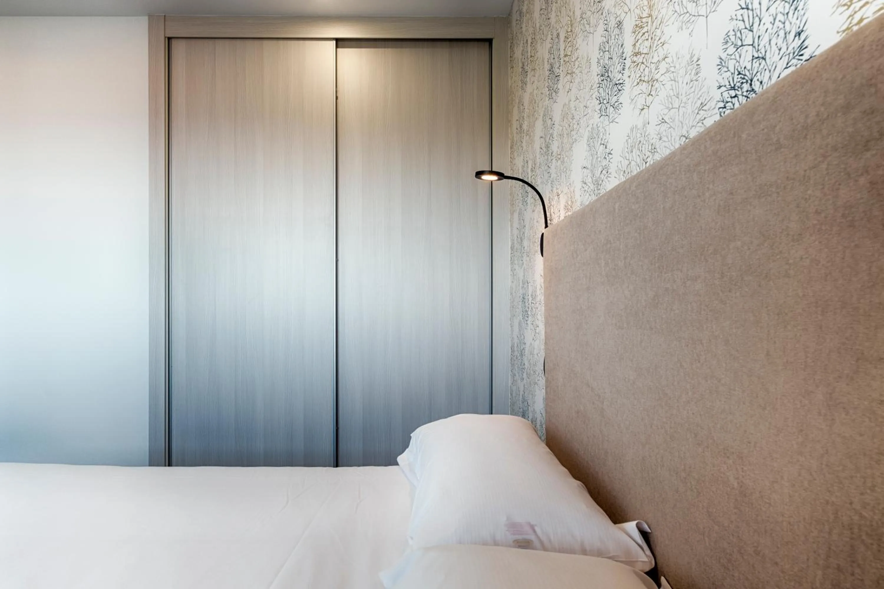 Bed in TH Apartments by Como en Casa