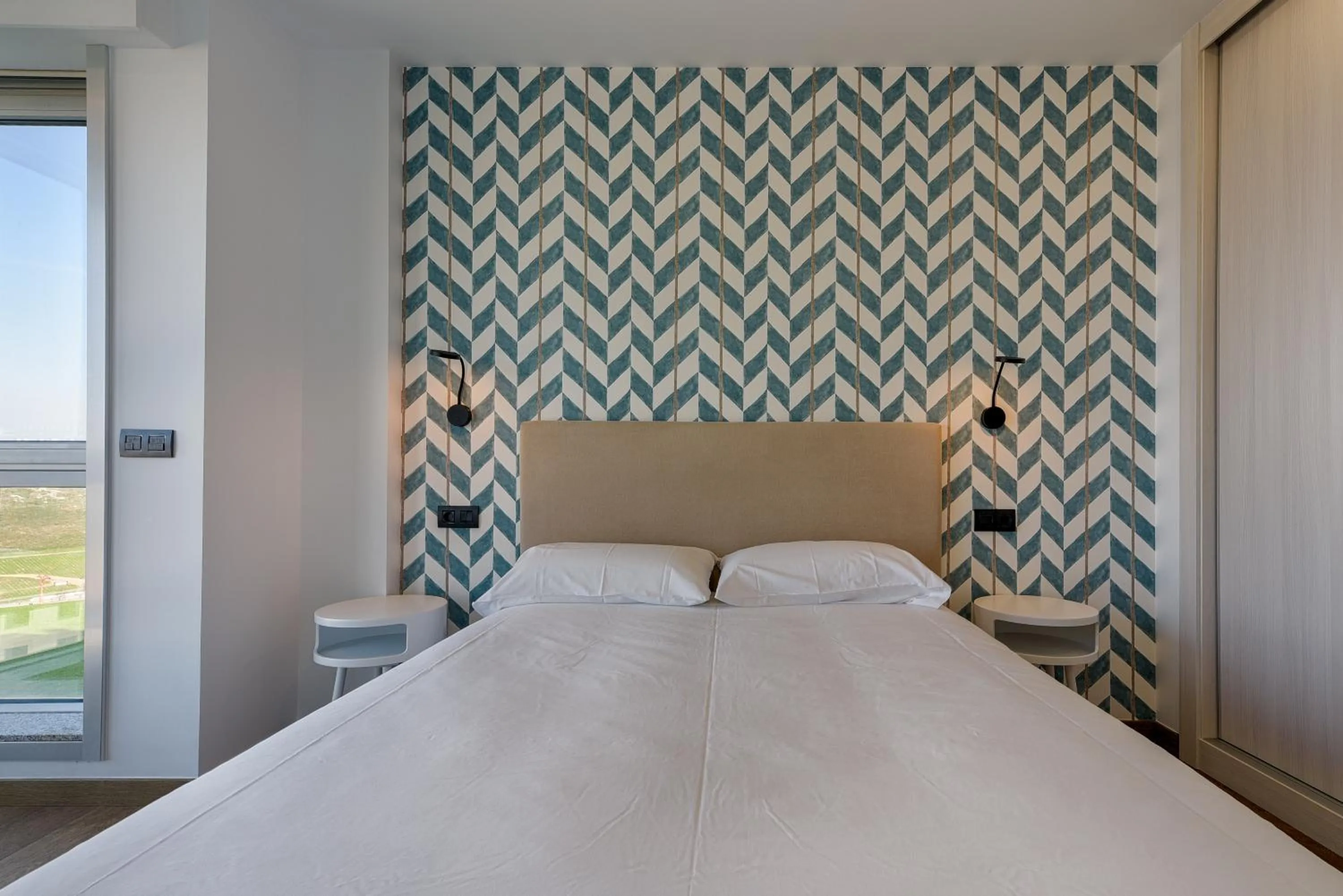 Bed in TH Apartments by Como en Casa