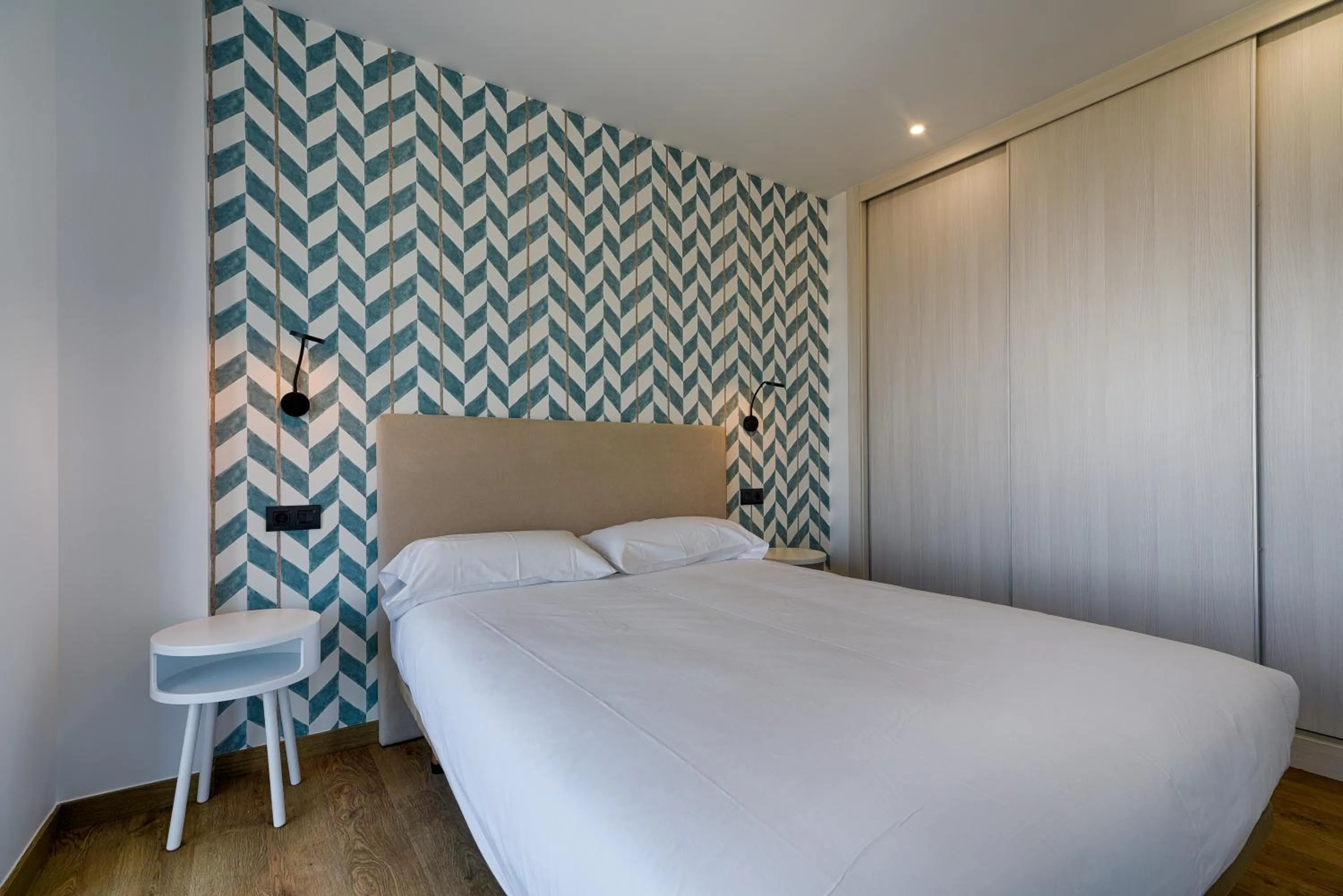 Bed in TH Apartments by Como en Casa