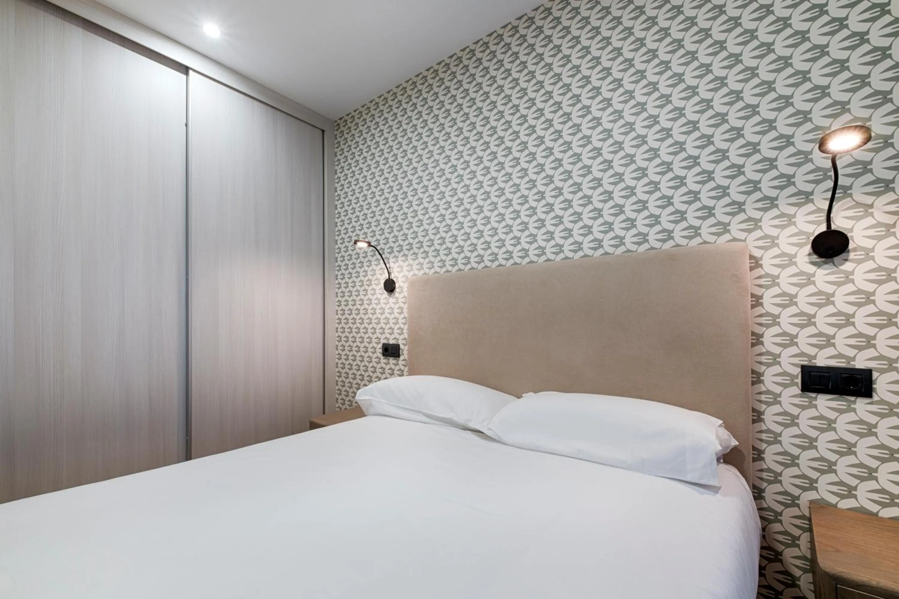 Bed in TH Apartments by Como en Casa