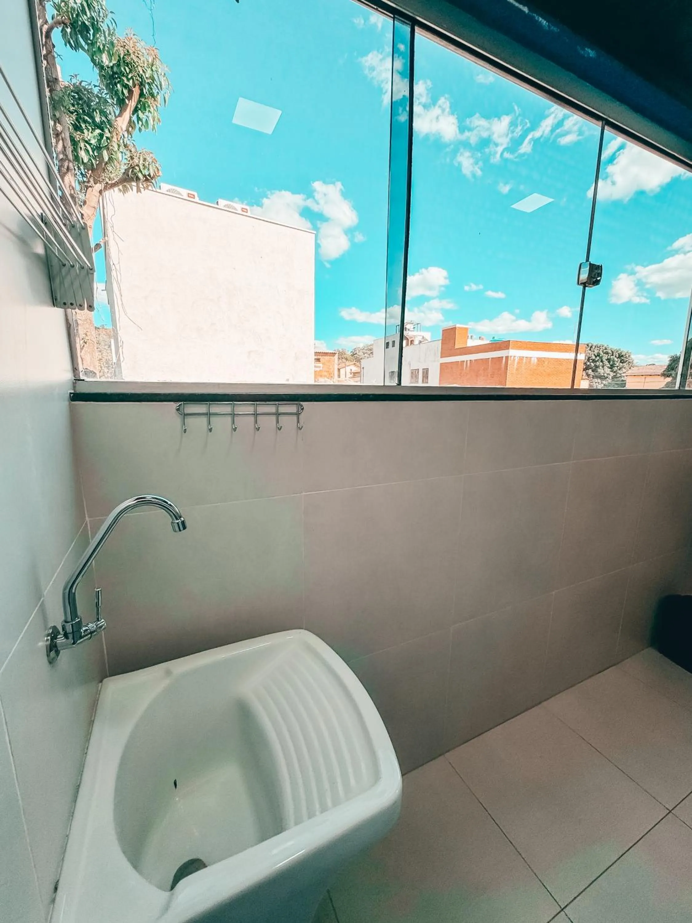 laundry in Village São Jorge - Guest Apartment