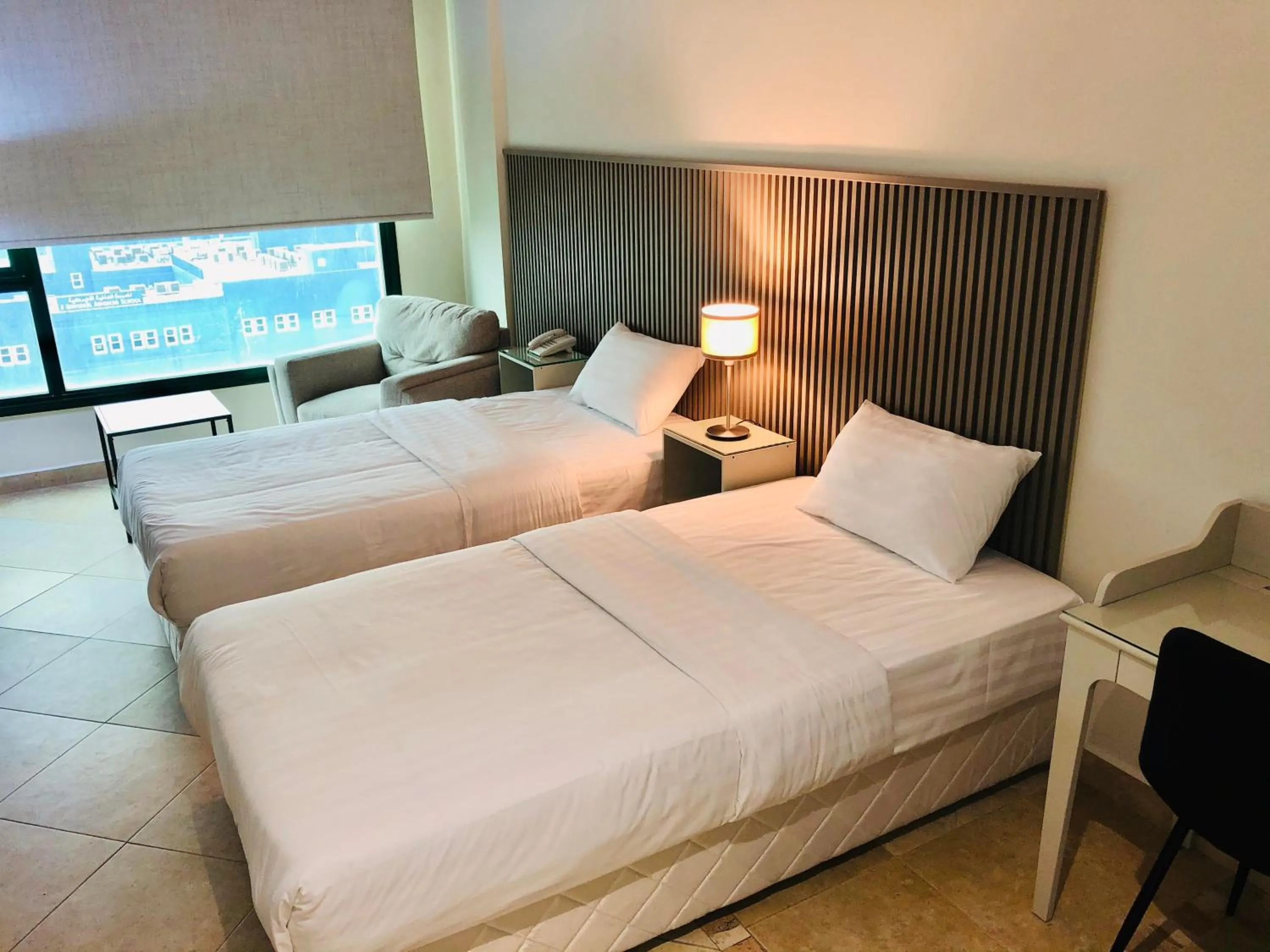 Bed in Times Square Suite Hotel