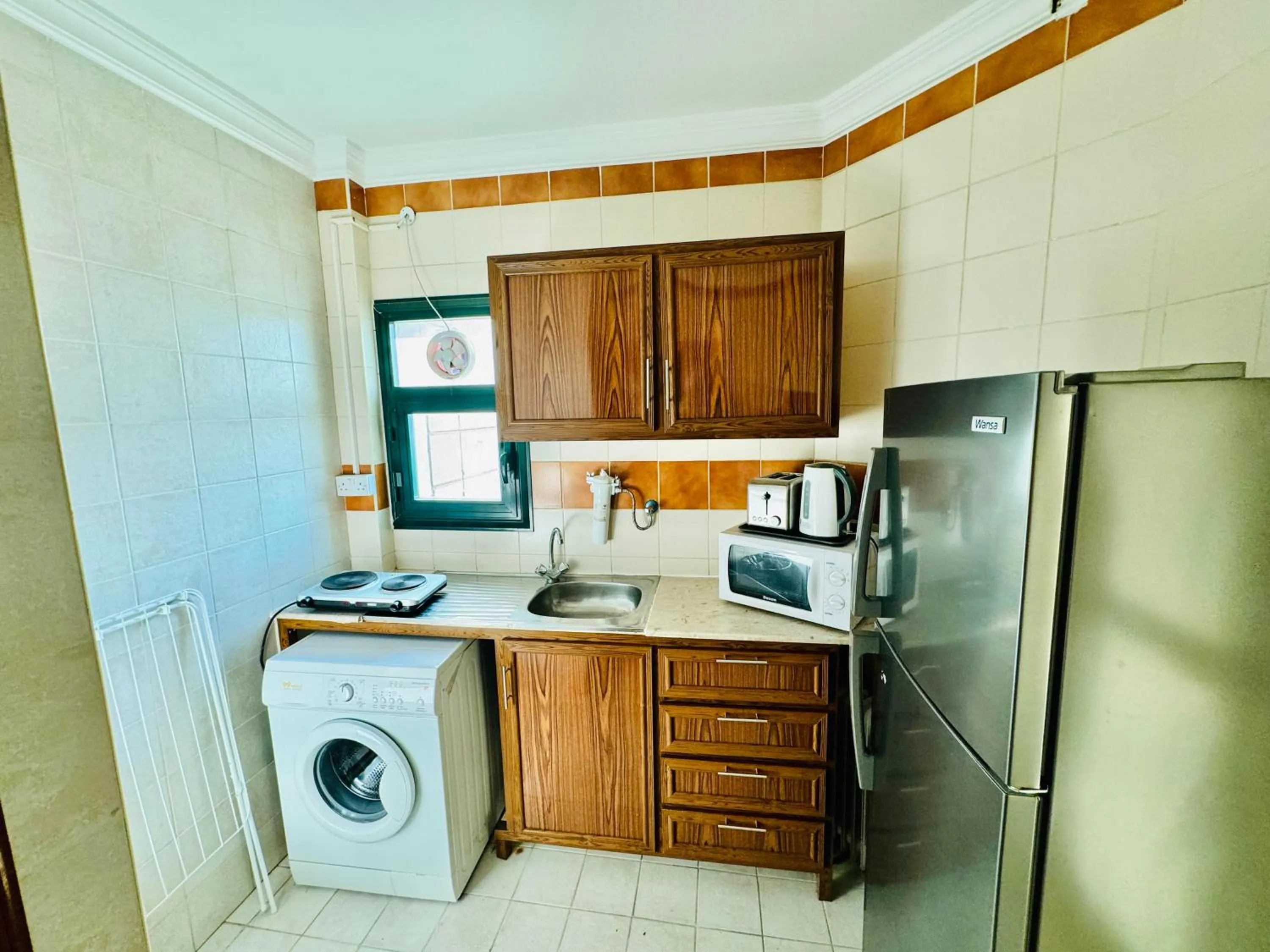 Kitchen or kitchenette in Times Square Suite Hotel