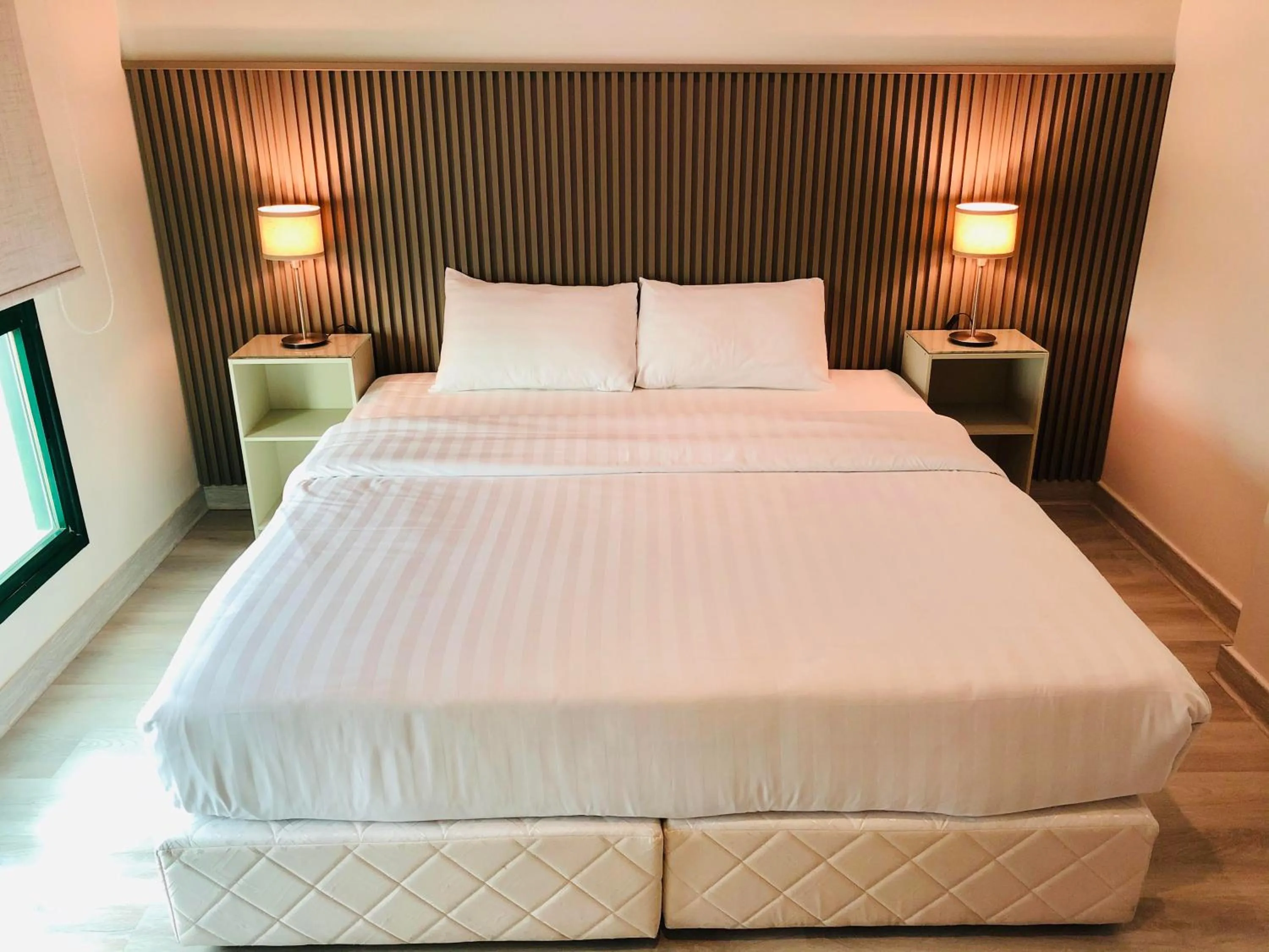 Bed in Times Square Suite Hotel