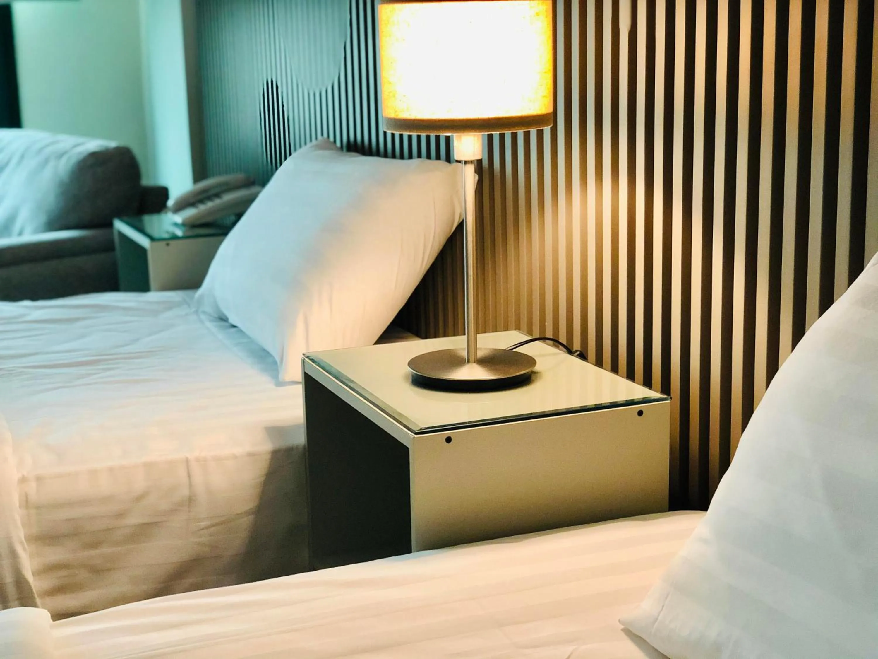 Bed in Times Square Suite Hotel