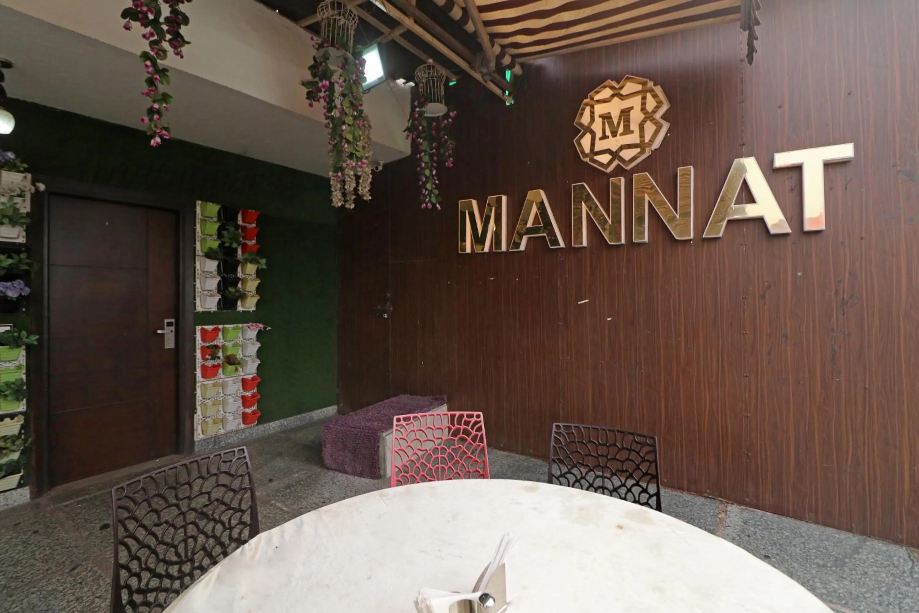 Property logo or sign in Hotel Mannat international by Mannat