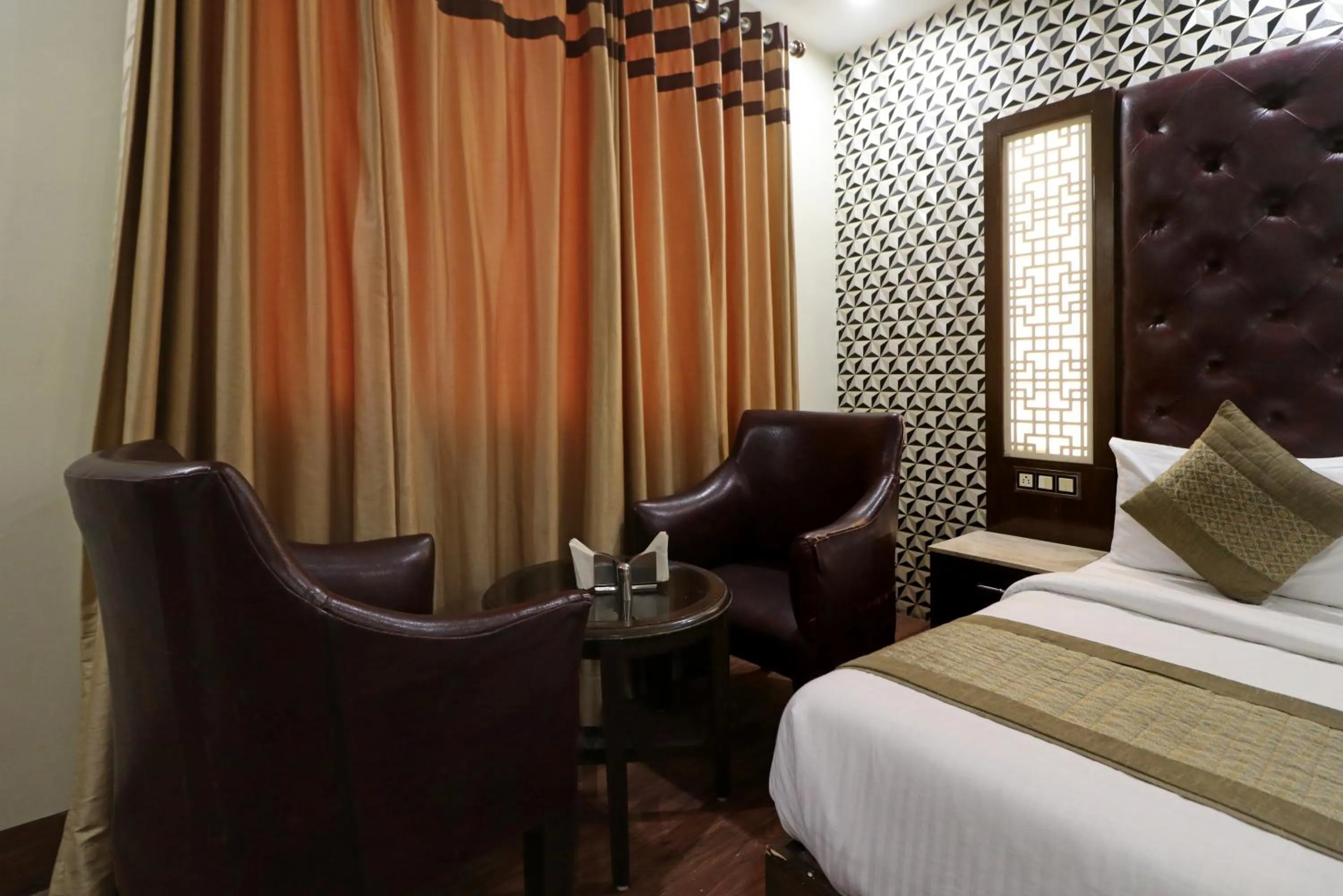 Living room, Bed in Hotel Mannat international by Mannat