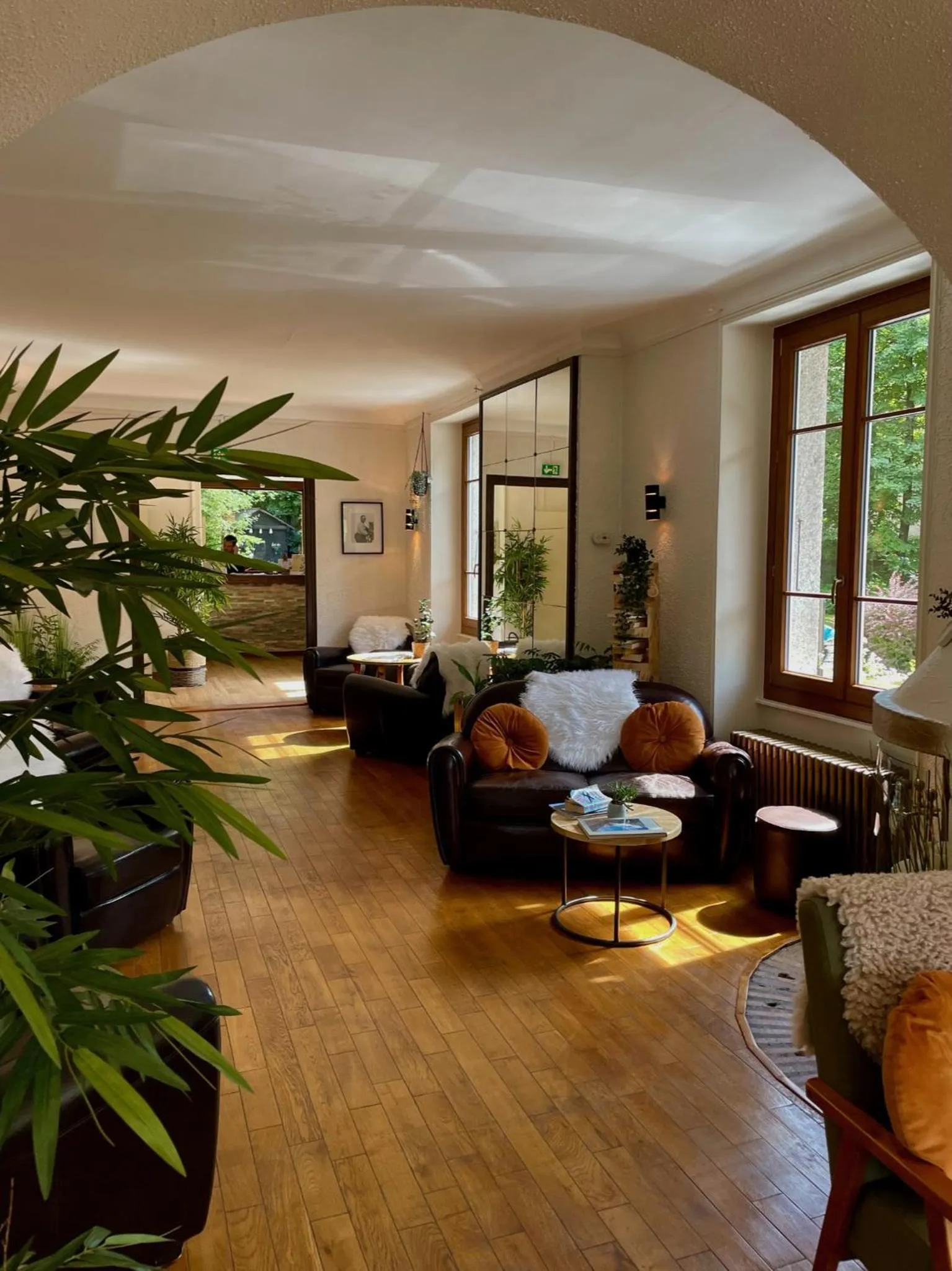 Communal lounge/ TV room in Chalet Hôtel La Sapinière