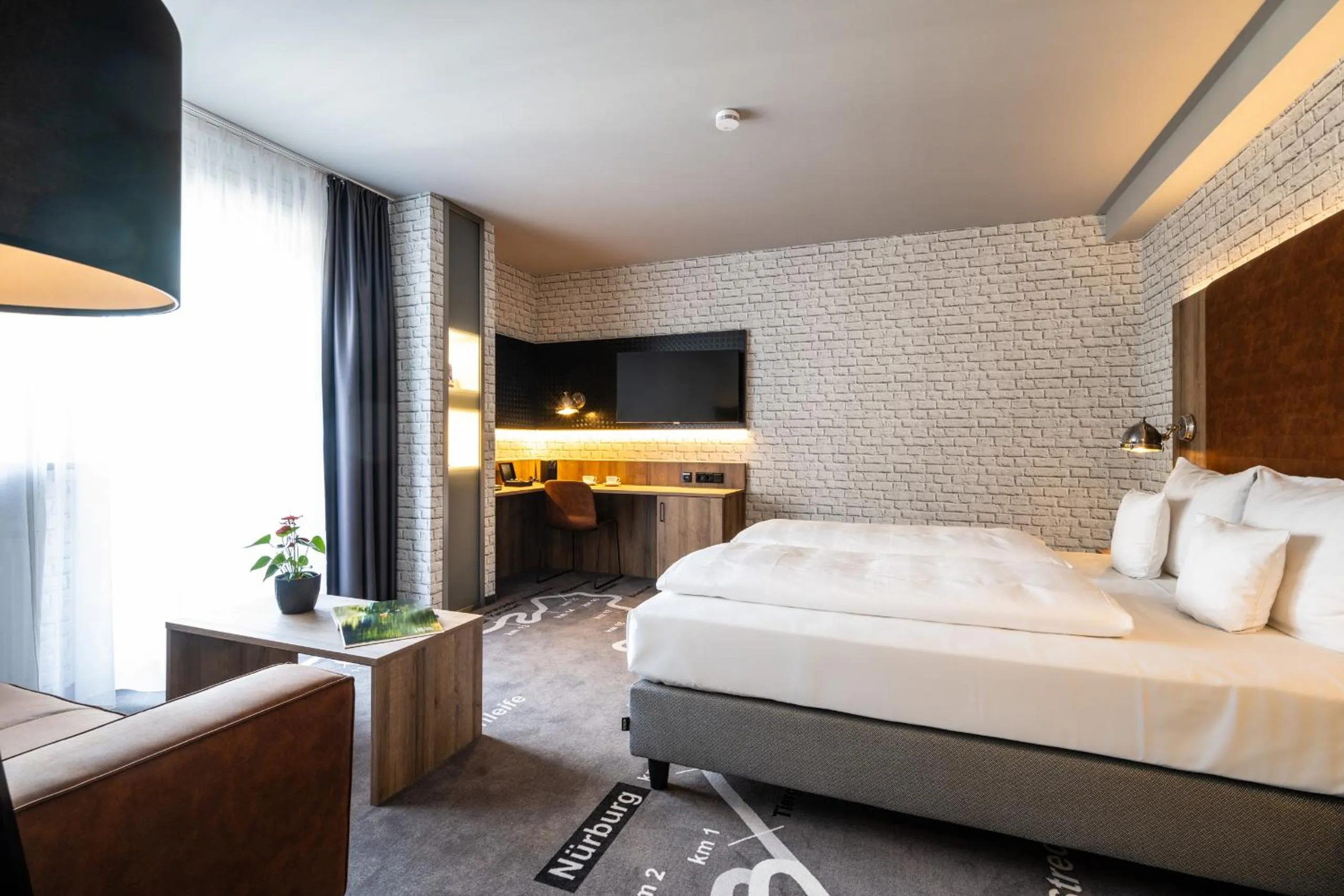 Living room, Bed in Hotel HerzogsPark