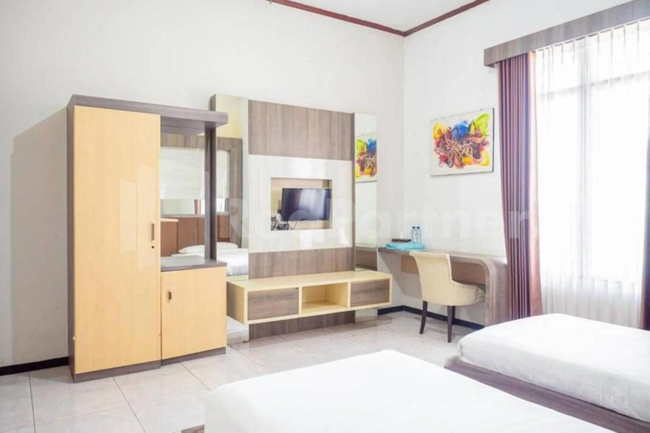 Bed in My Hommy Homestay Mitra RedDoorz