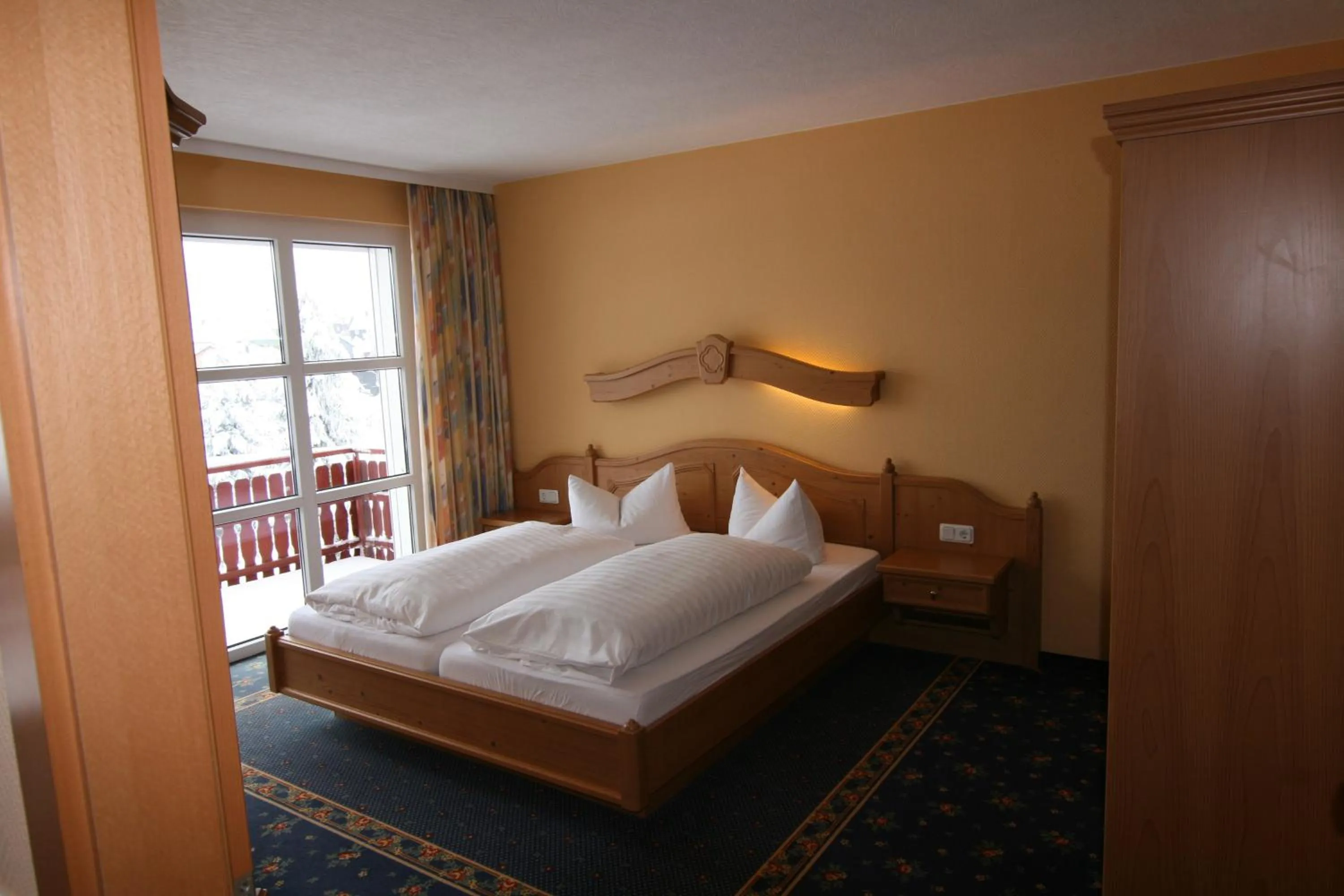 Photo of the whole room, Bed in Vitalhotel Sonneneck