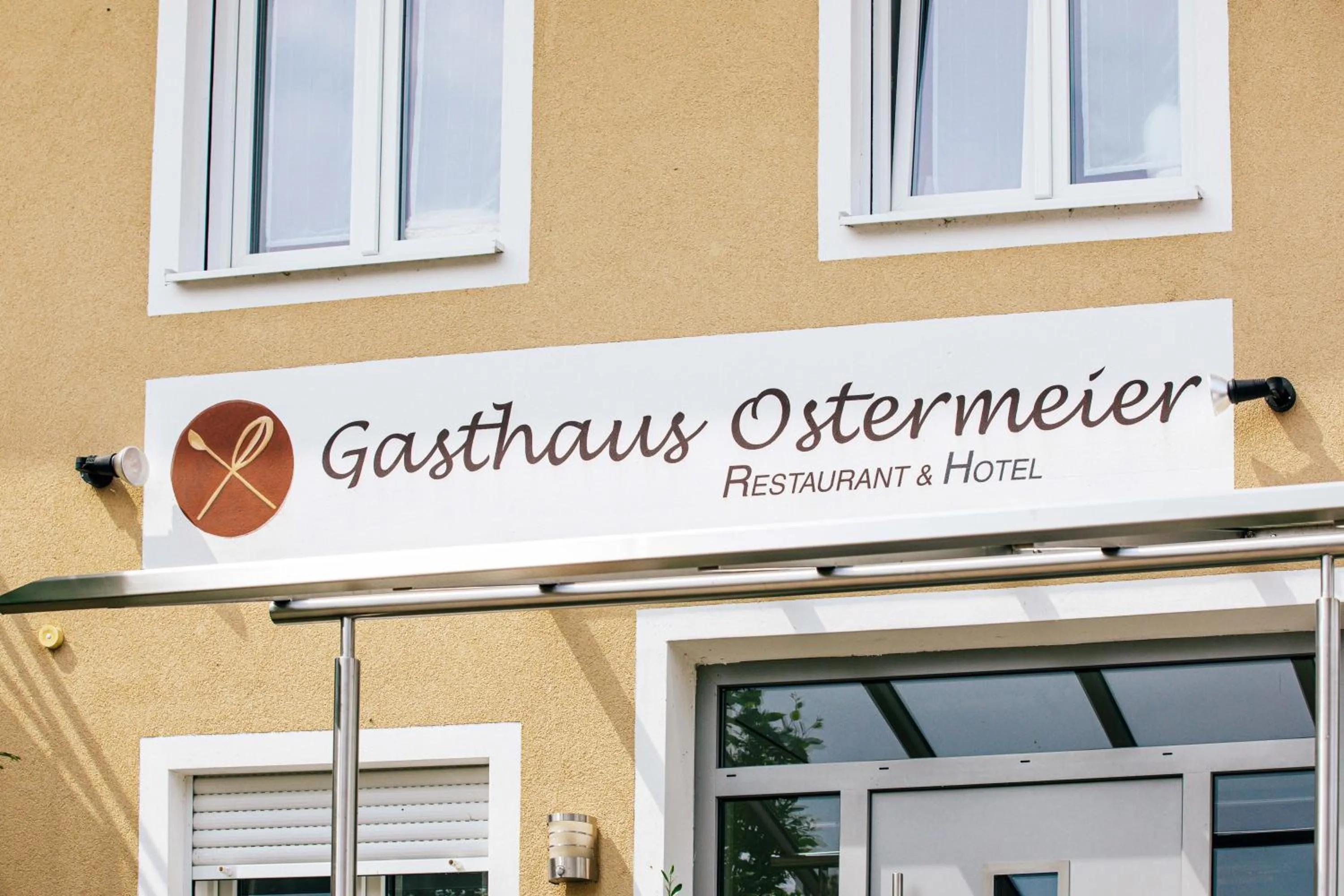 Property logo or sign in Gasthaus Hotel Ostermeier