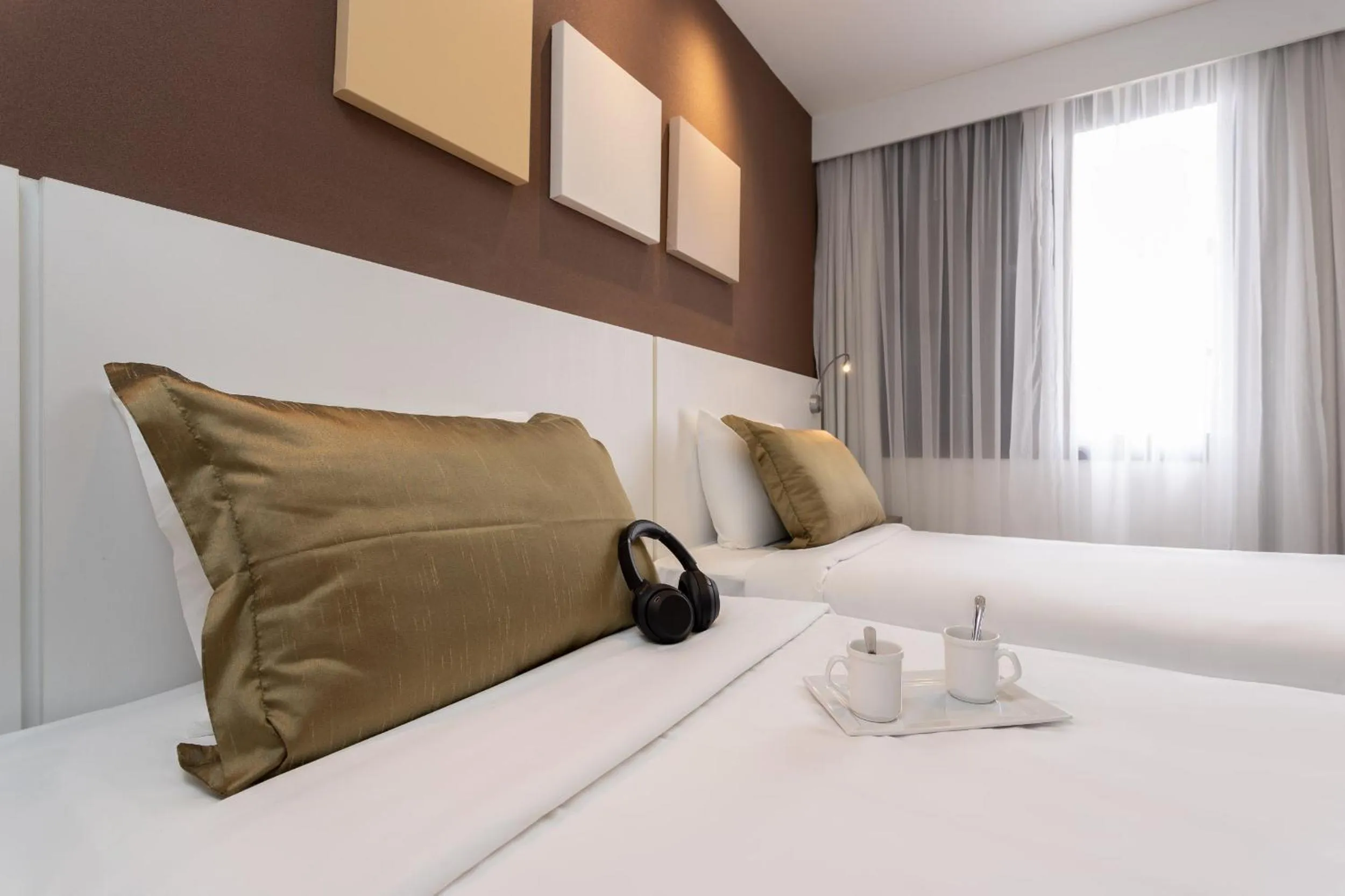 Bed in Paulista Suites by Charlie