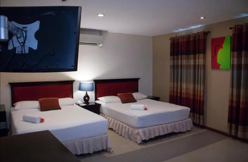 Bed in Curacao Suites Hotel