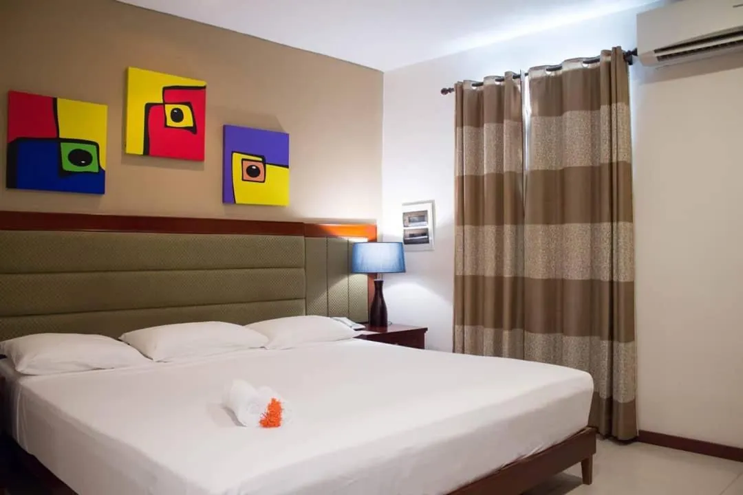 Bed in Curacao Suites Hotel