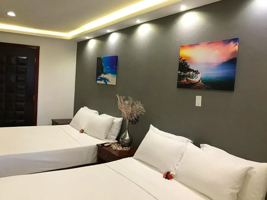 Bed in Curacao Suites Hotel