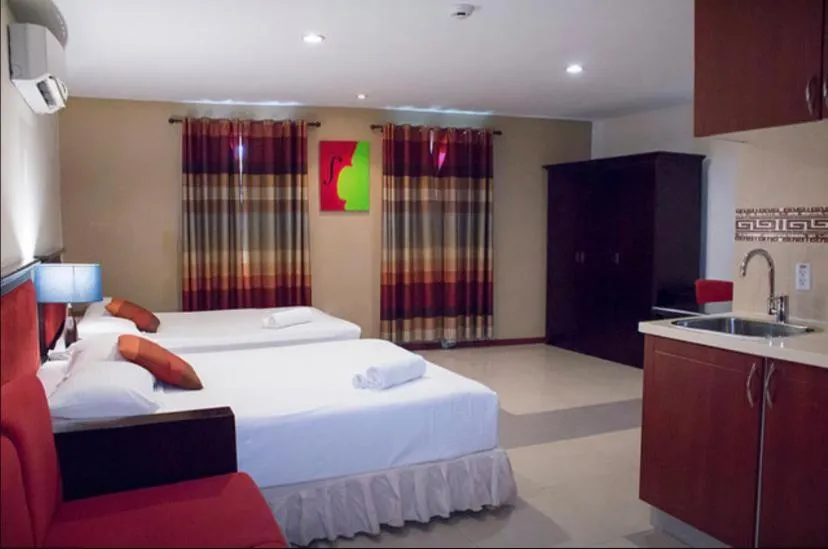 Bed in Curacao Suites Hotel
