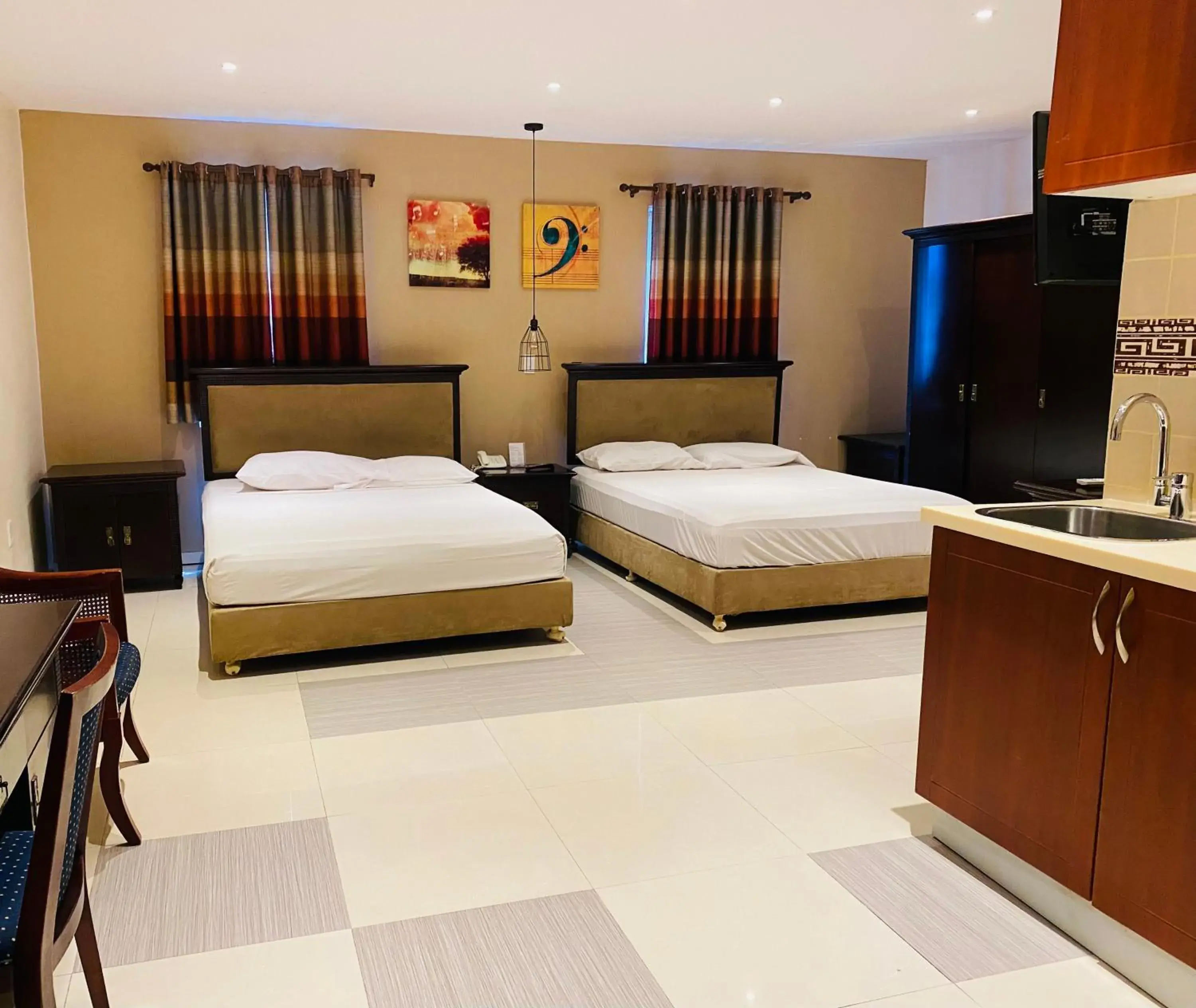 Standard Queen Room with Two Queen Beds - single occupancy in Curacao Suites Hotel Standard Queen Room with Two Queen Beds - single occupancy in Curacao Suites Hotel