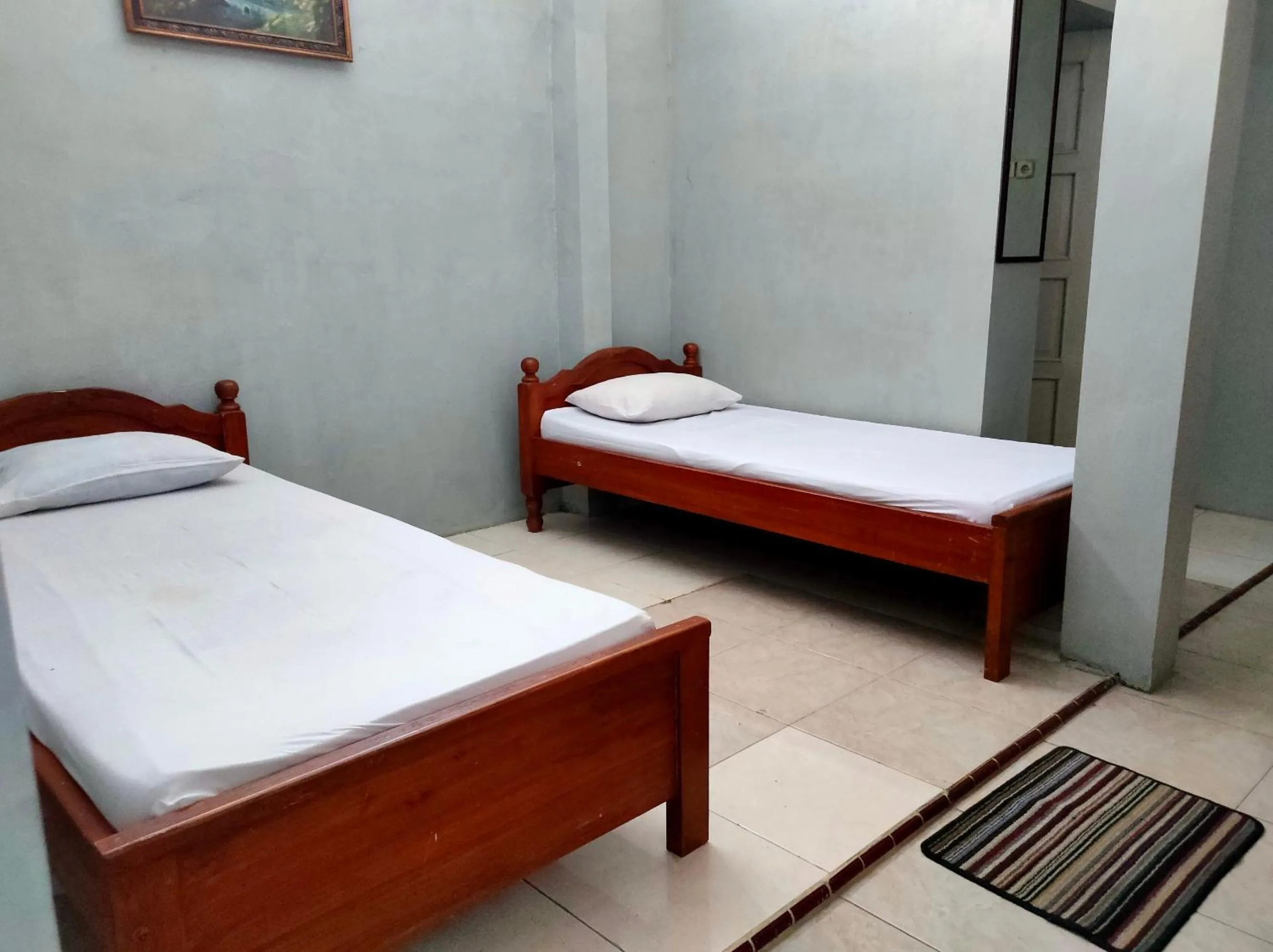 Bed in Hotel Keluarga Mekar Jaya Syariah Near UNS Solo