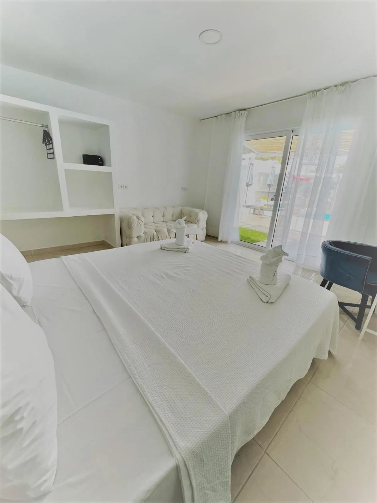 Living room, Bed in Bamboo Suites Hotel - Adults Only