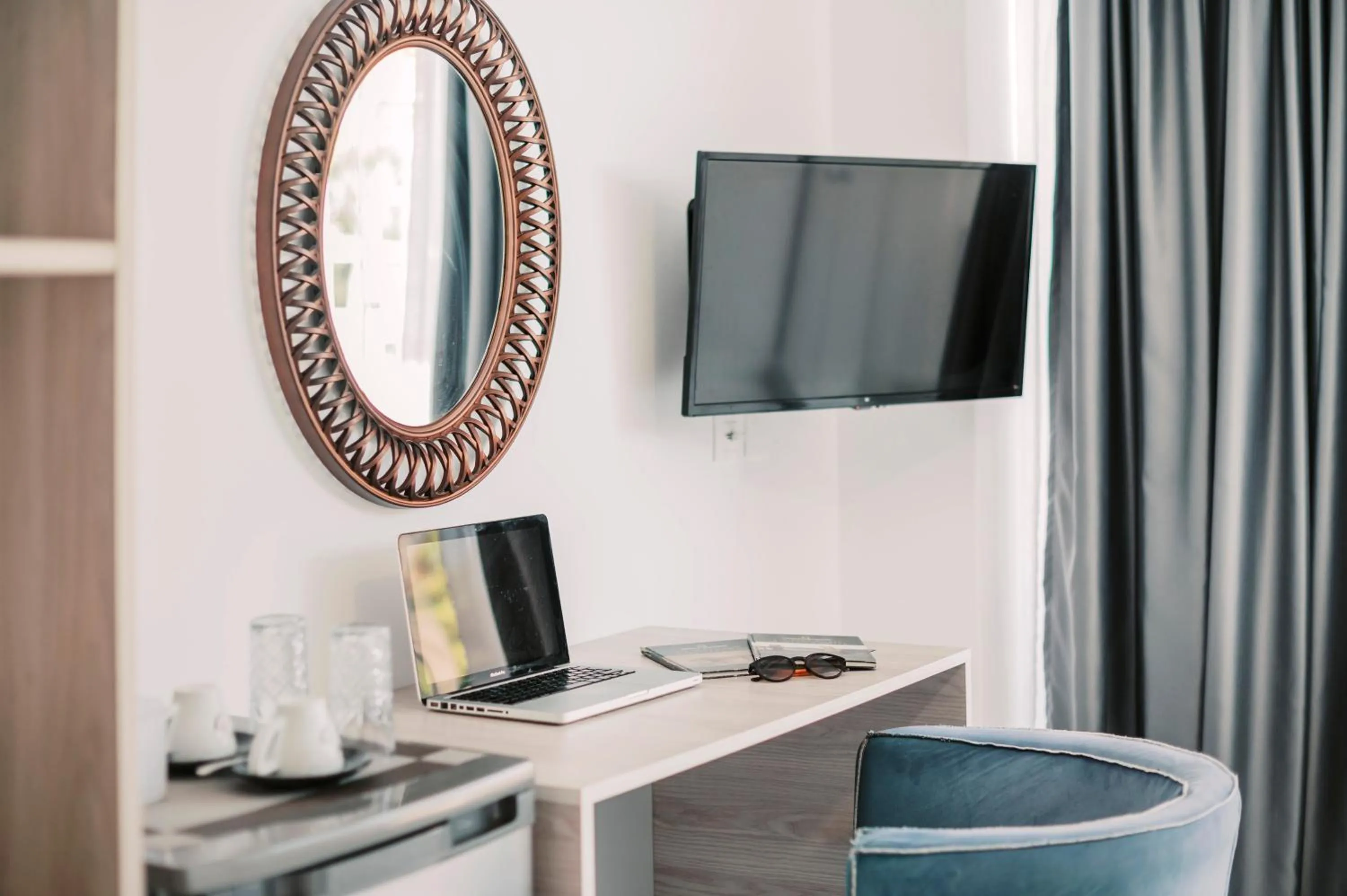 TV and multimedia in Bamboo Suites Hotel - Adults Only