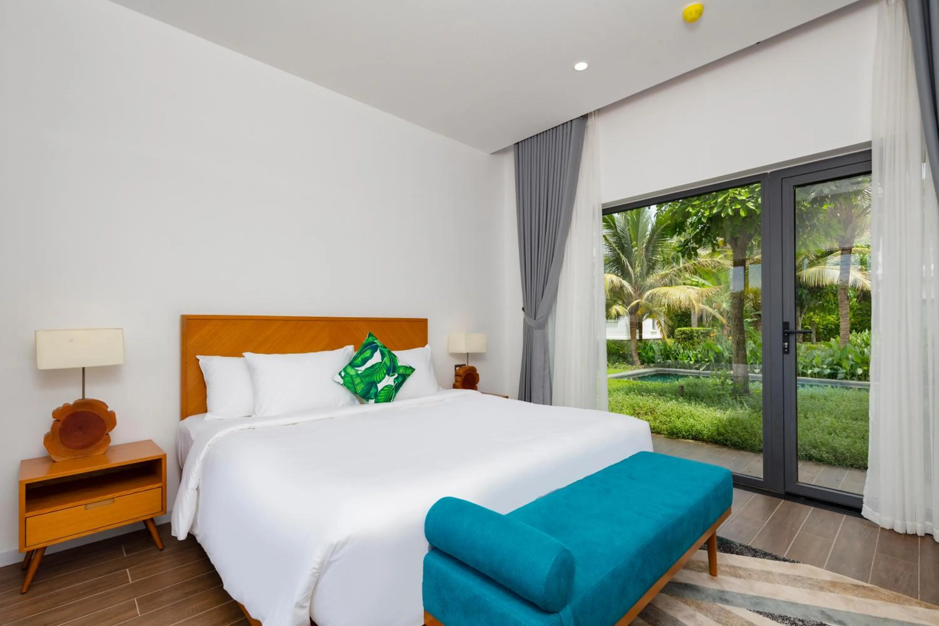 Bedroom, Bed in Le Palmier Ho Tram Resort - Beachfront with Private Beach