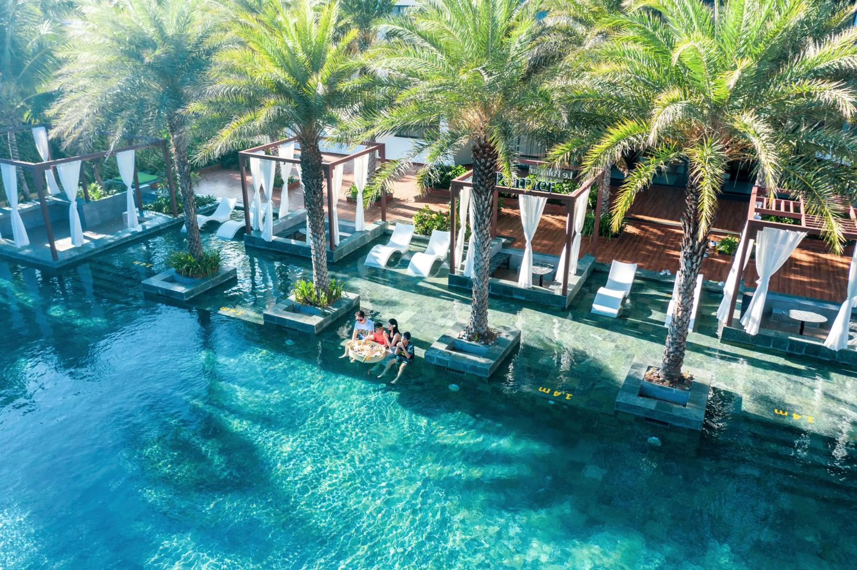 Swimming pool in Le Palmier Ho Tram Resort - Beachfront with Private Beach