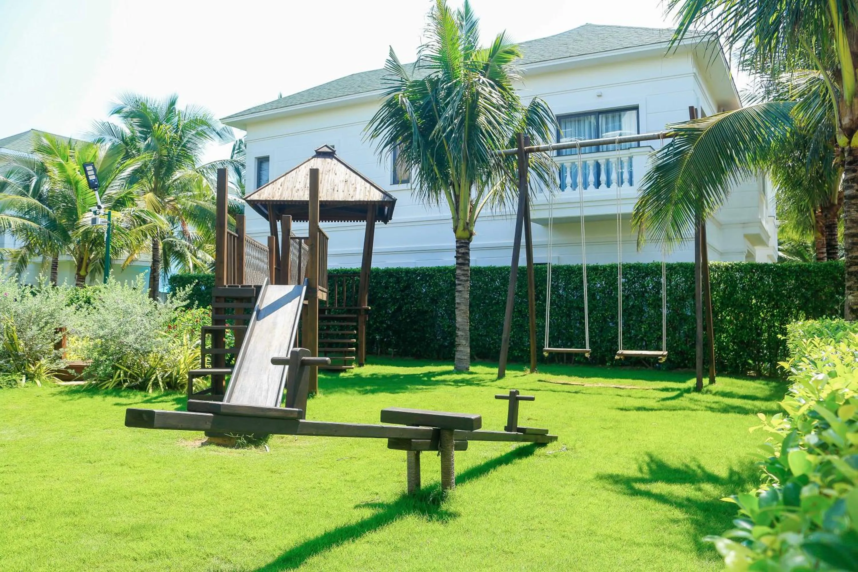 Children play ground in Le Palmier Ho Tram Resort - Beachfront with Private Beach