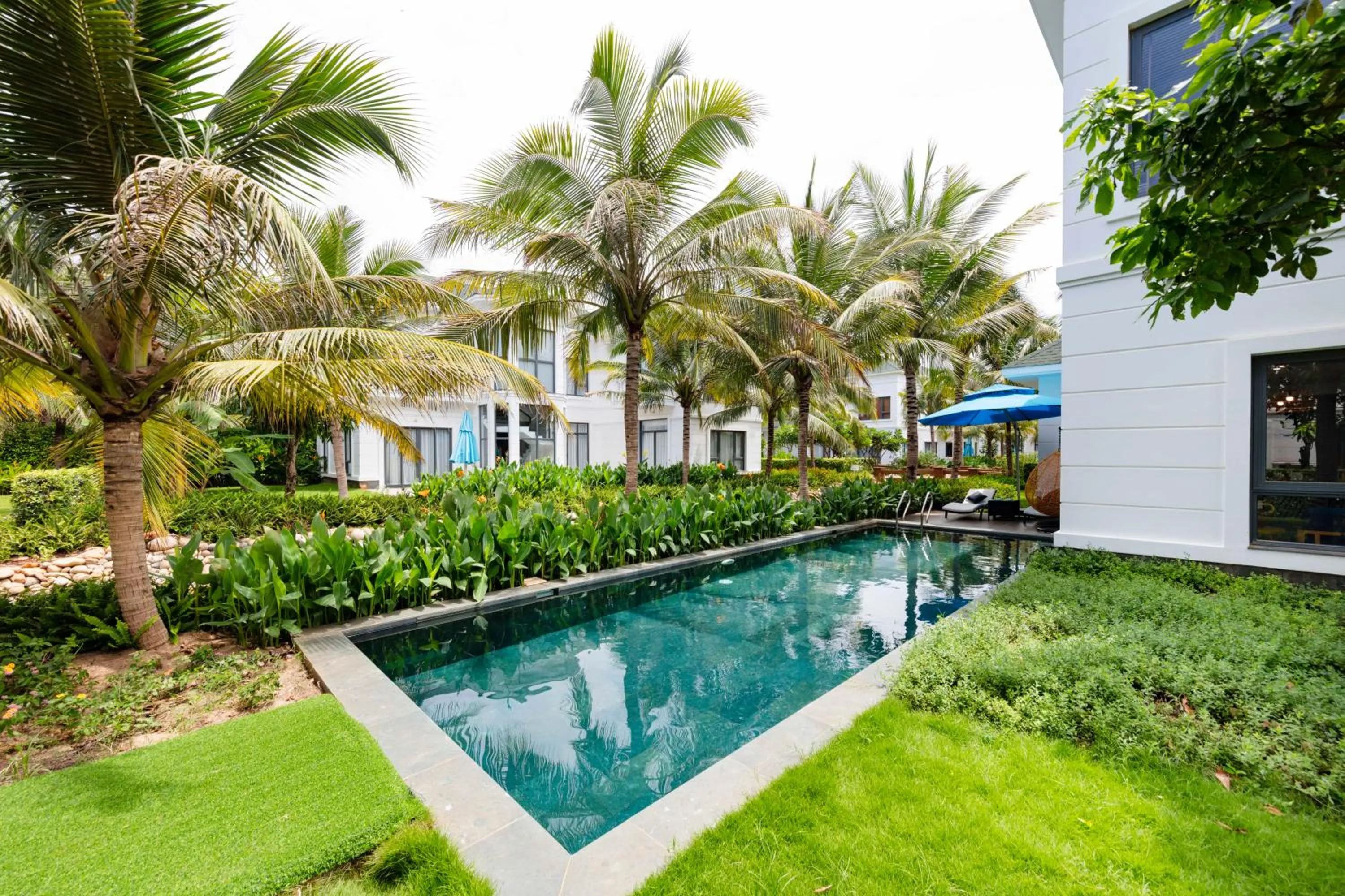 Swimming pool in Le Palmier Ho Tram Resort - Beachfront with Private Beach