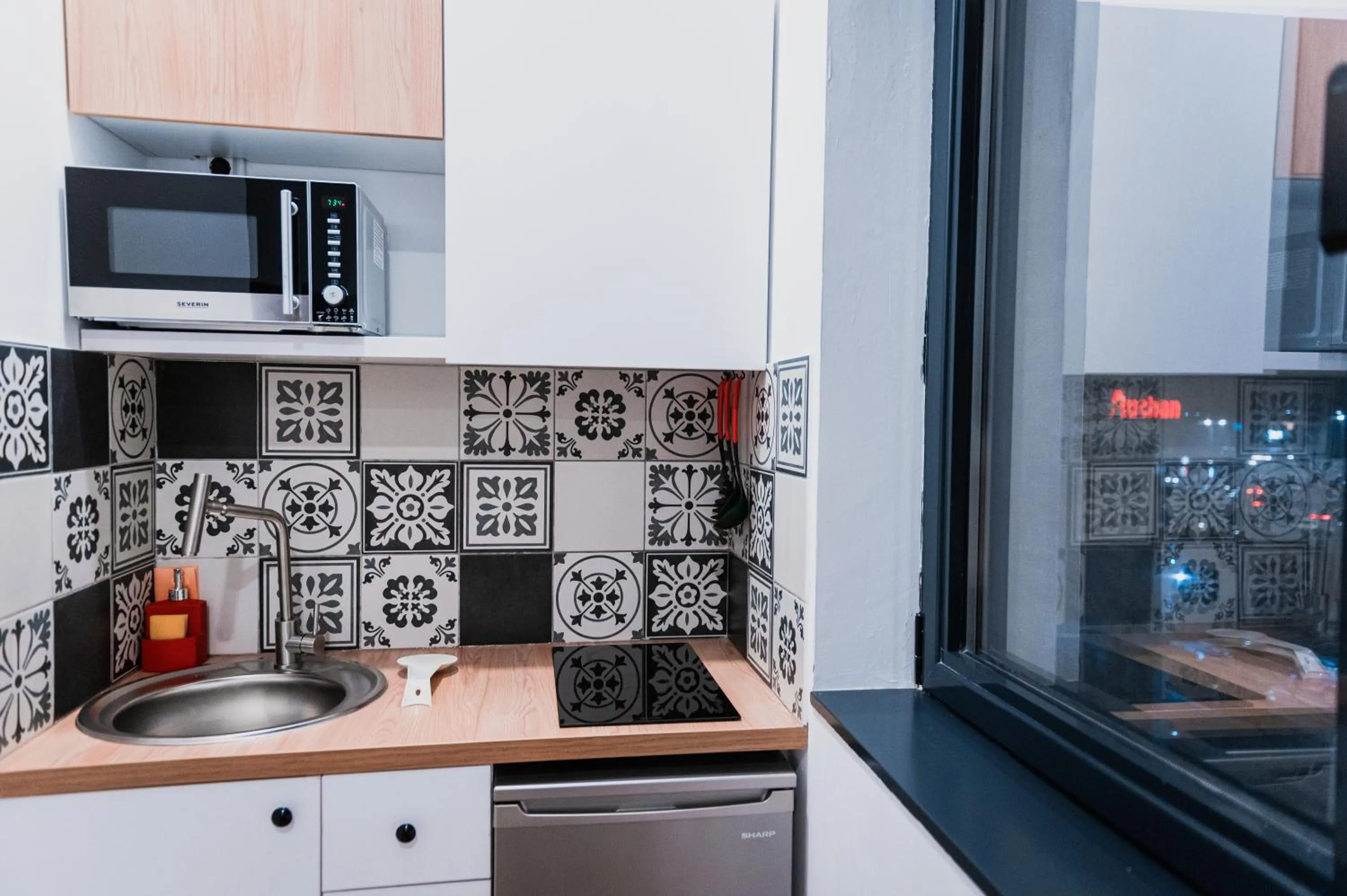 Kitchen or kitchenette in Puzzle Apartaments&Studios