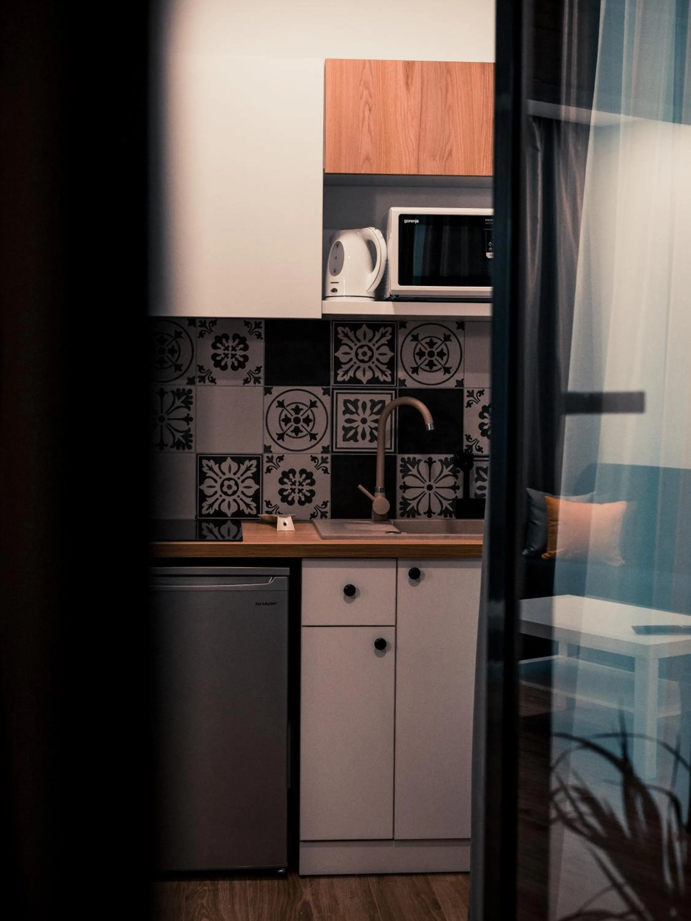 Kitchen or kitchenette in Puzzle Apartaments&Studios