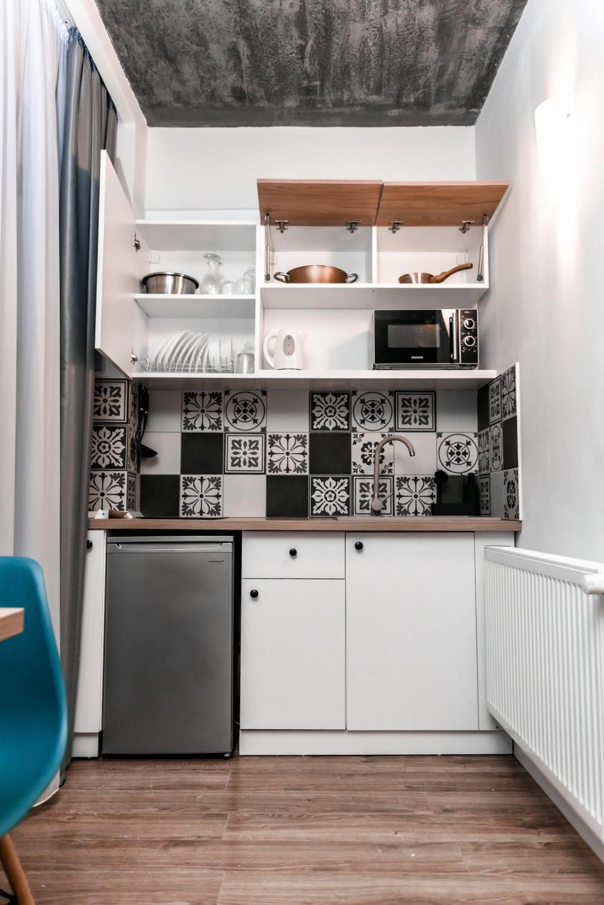 Kitchen or kitchenette in Puzzle Apartaments&Studios