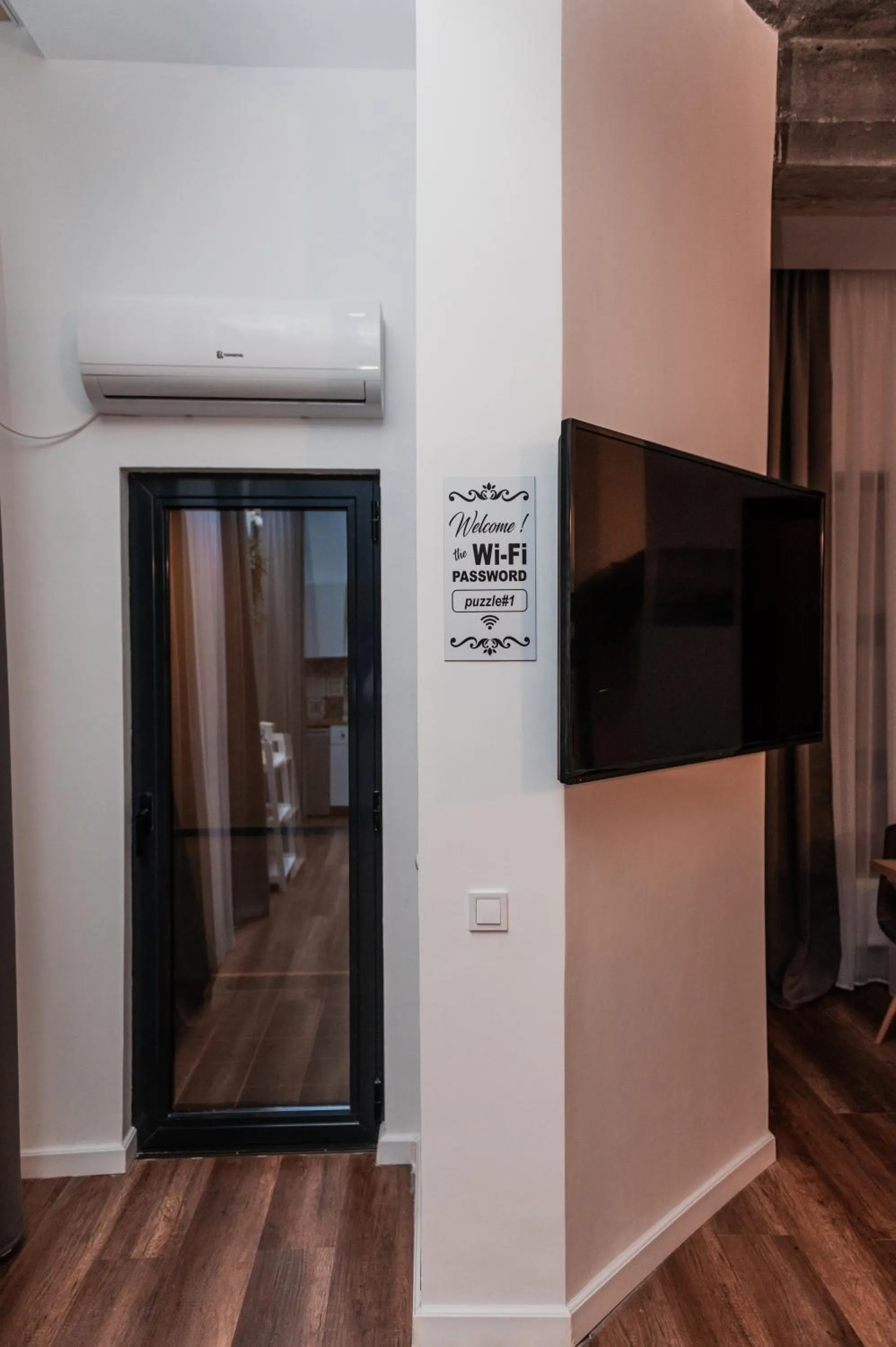 TV and multimedia in Puzzle Apartaments&Studios