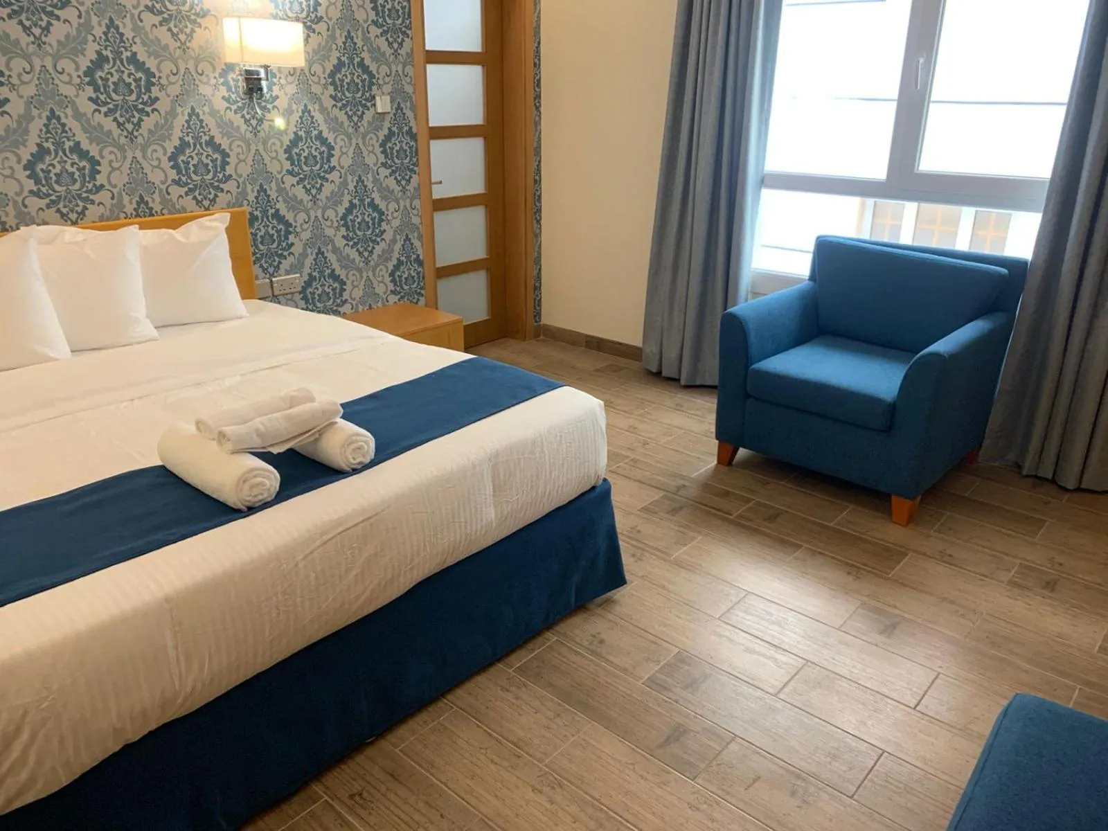 Seating area, Bed in Sama Muscat Hotel