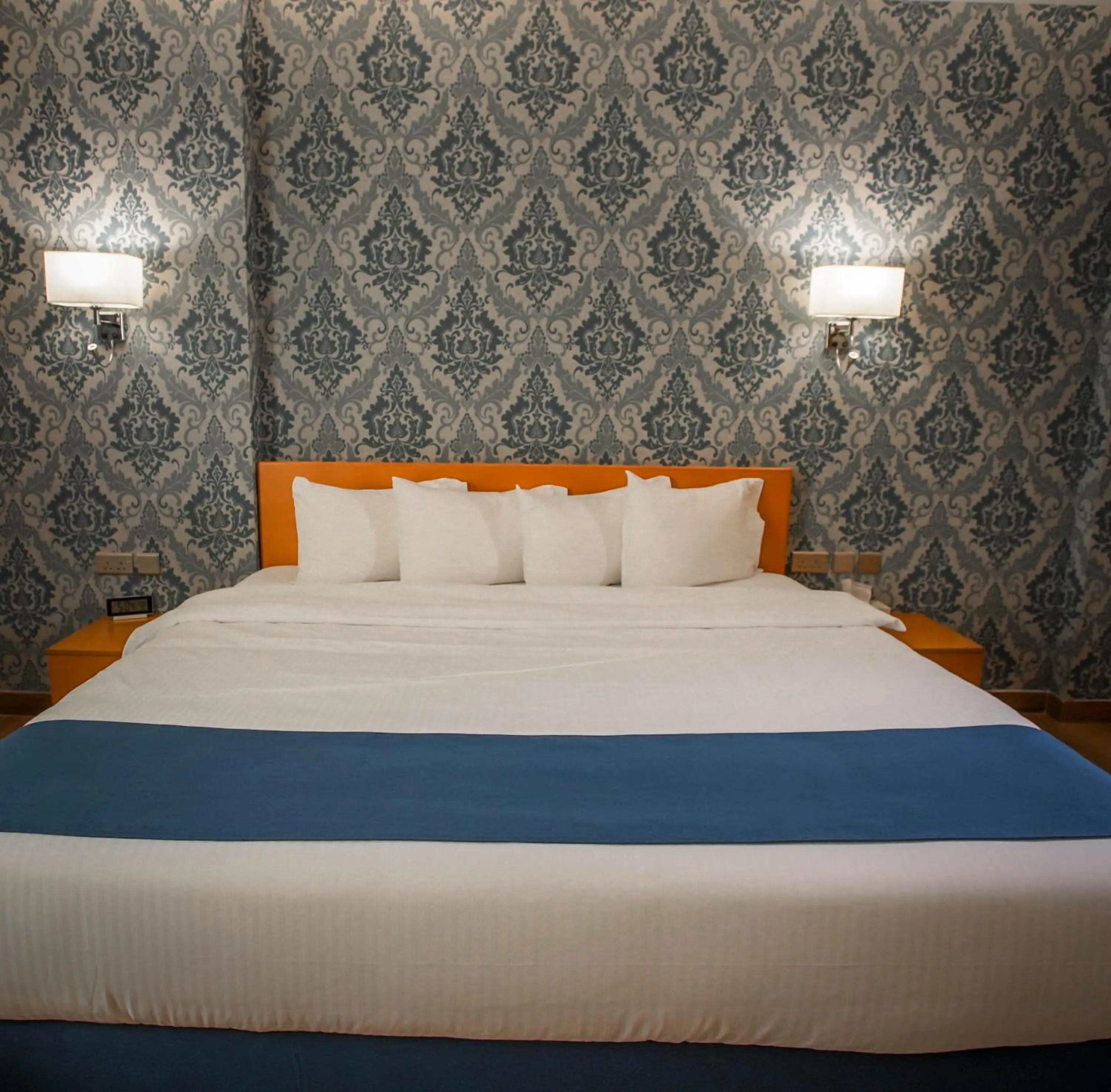 Bed in Sama Muscat Hotel