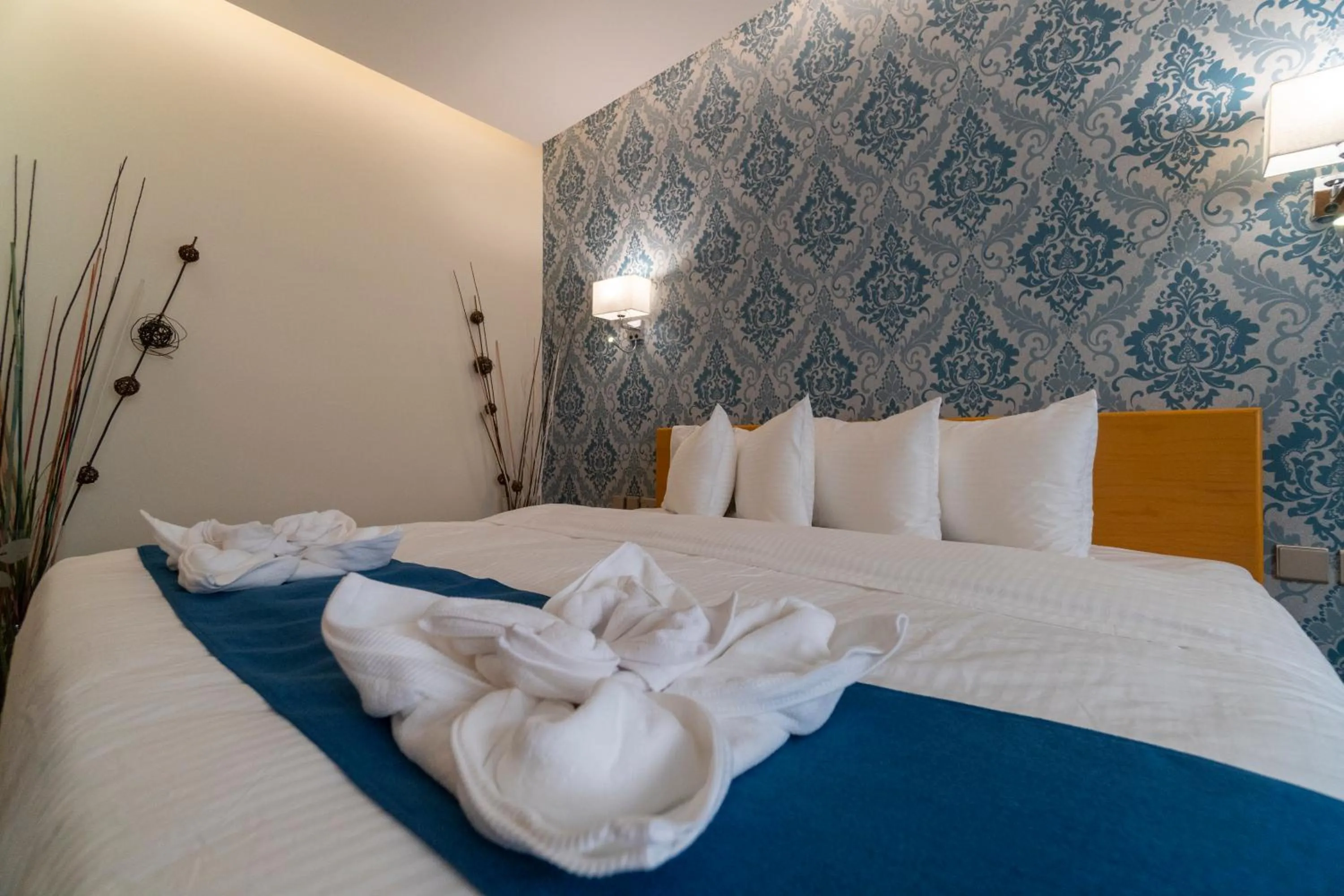 Bed in Sama Muscat Hotel