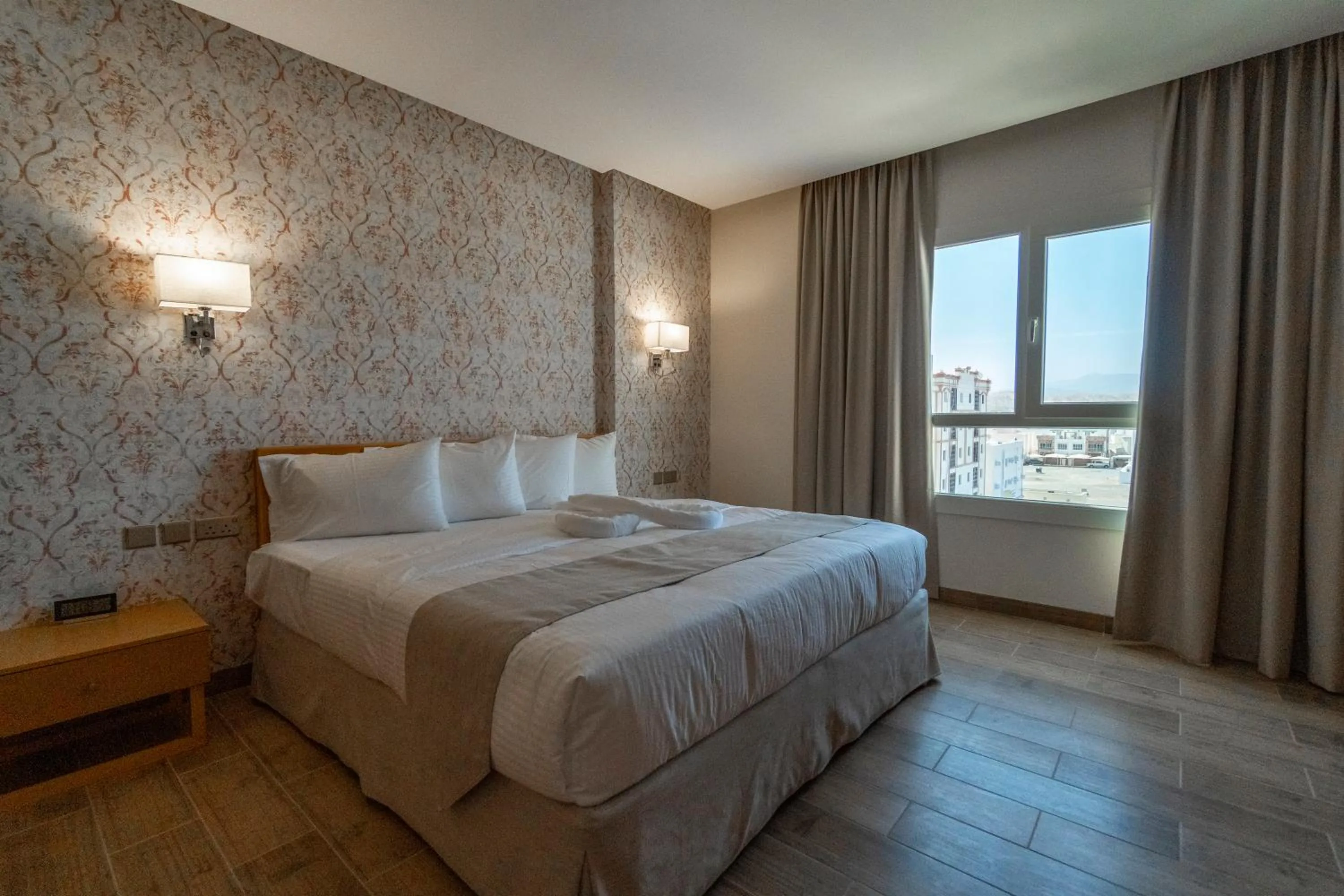 Bed in Sama Muscat Hotel