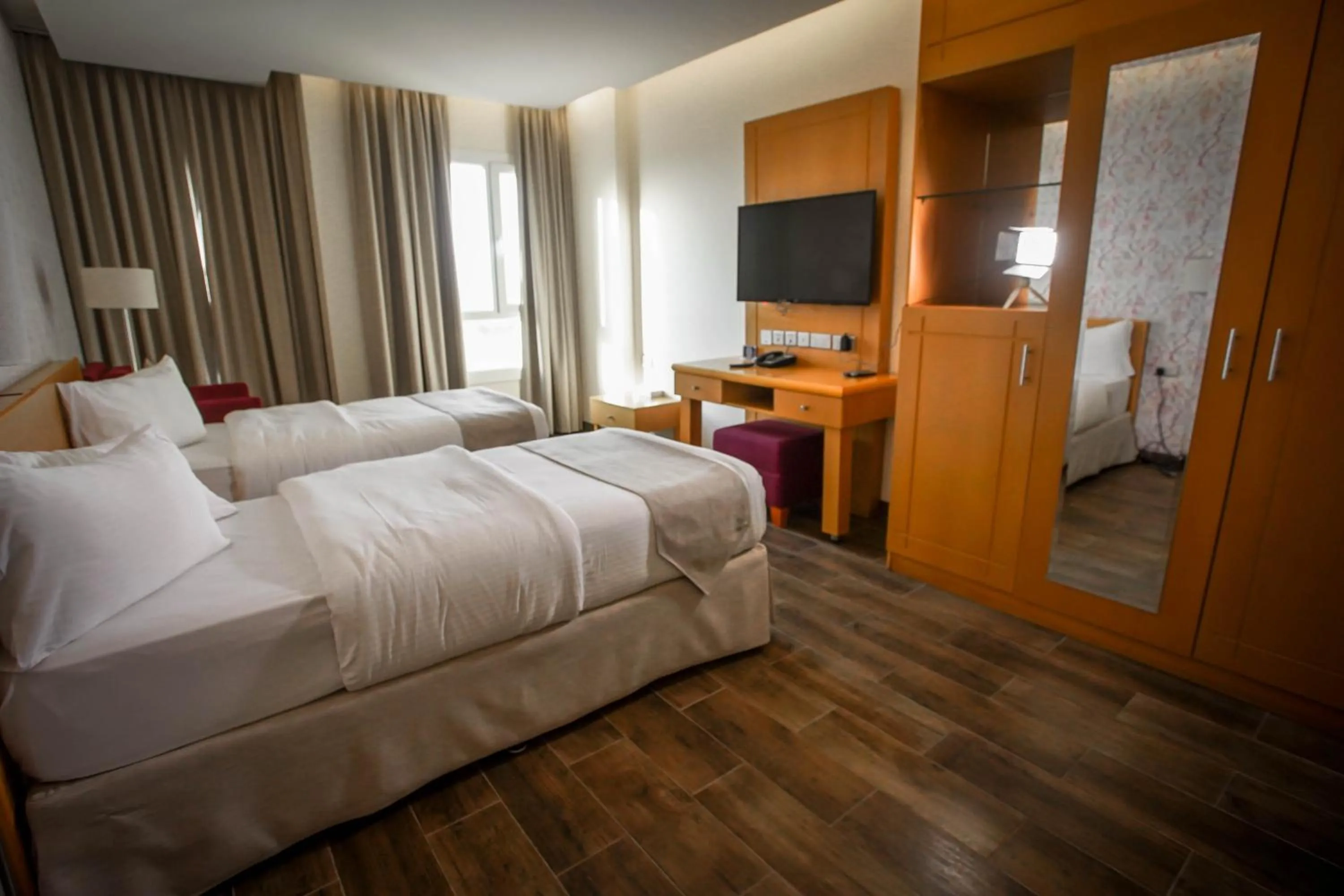 Bed in Sama Muscat Hotel