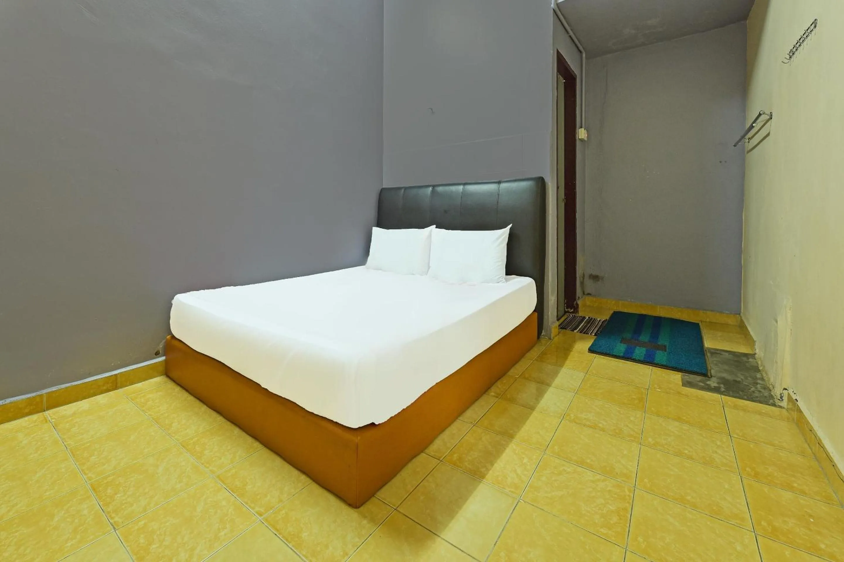 Bedroom in SPOT ON 90144 Corridor Hotel 1