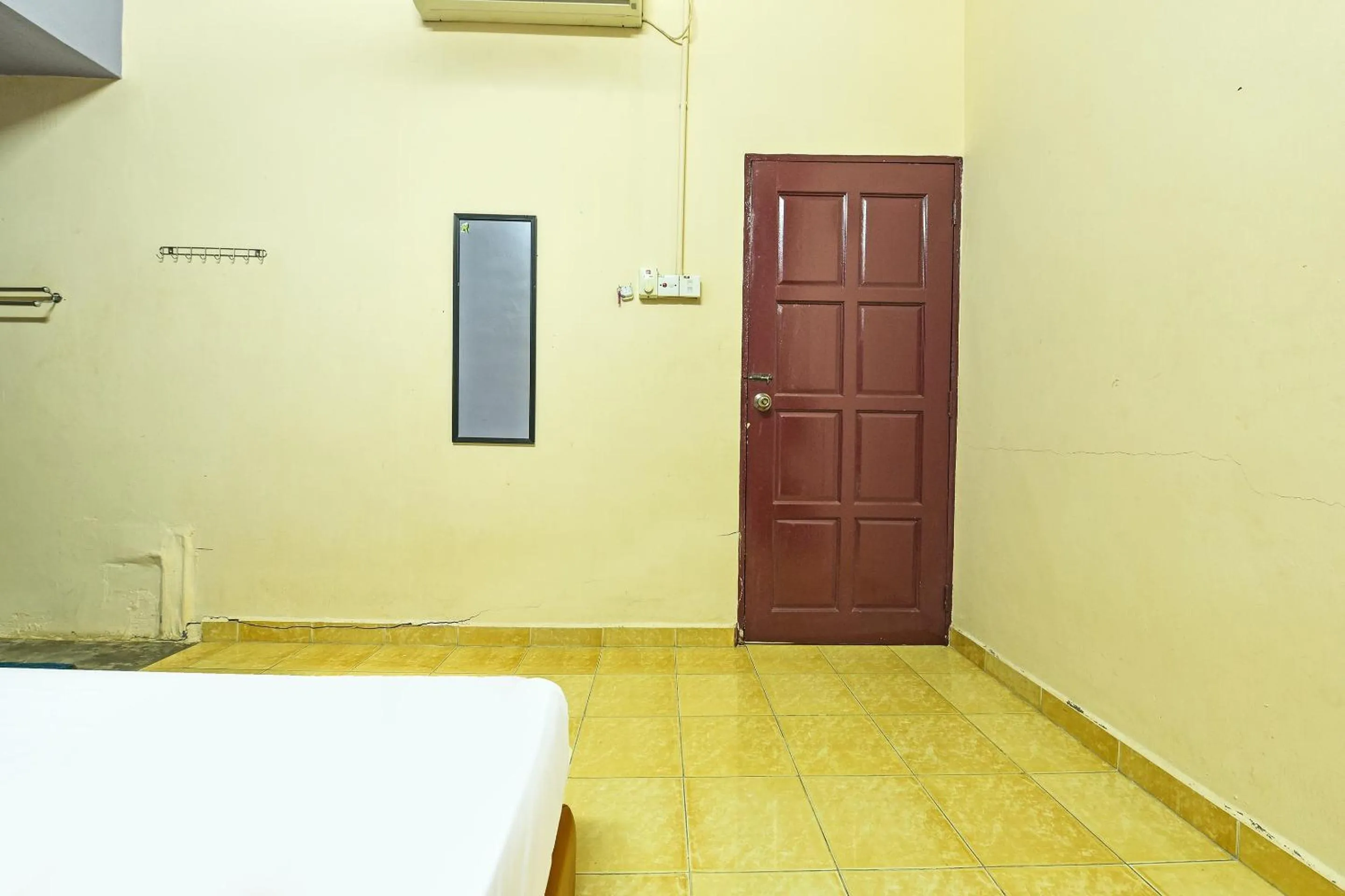 Bedroom in SPOT ON 90144 Corridor Hotel 1