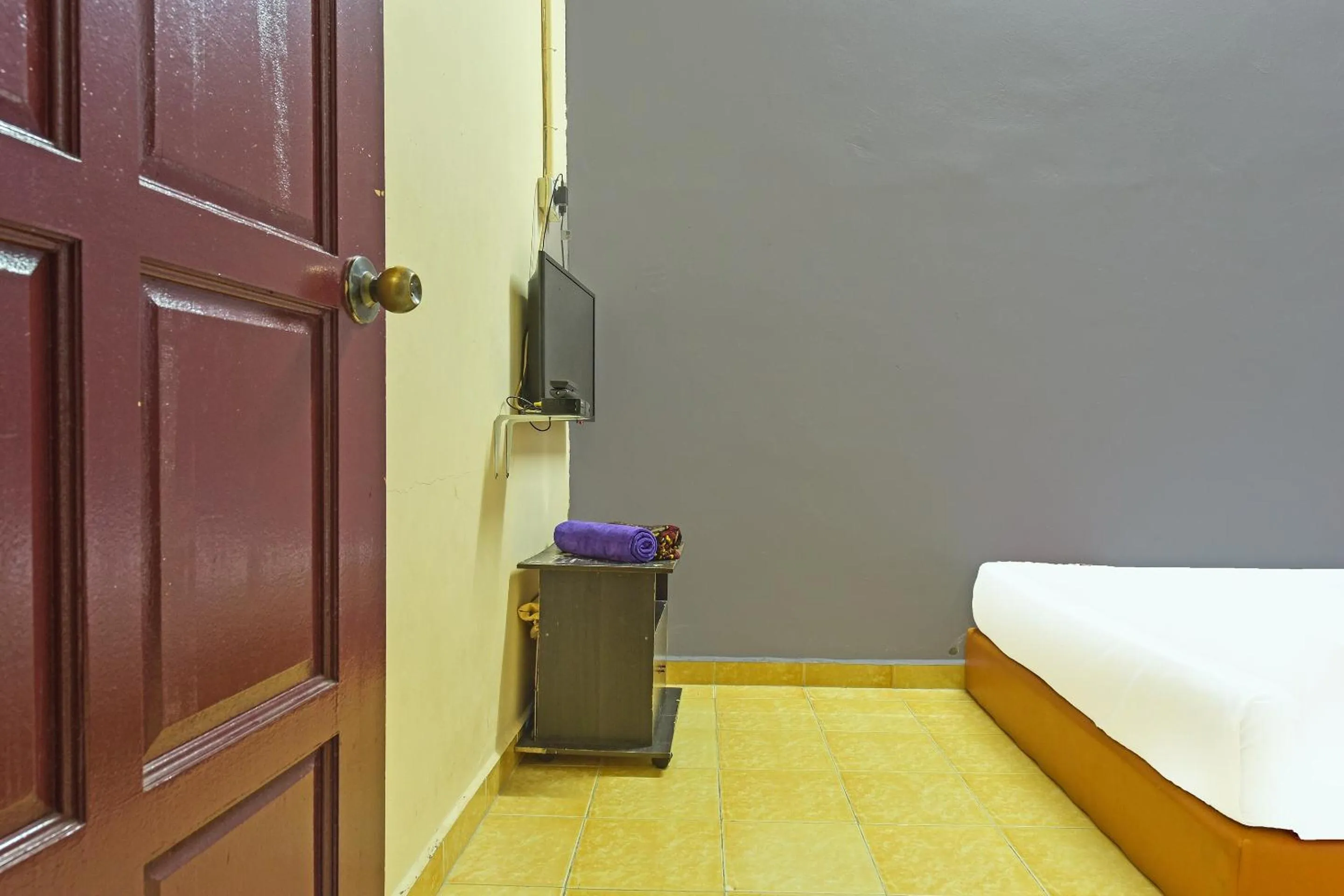 Bedroom in SPOT ON 90144 Corridor Hotel 1