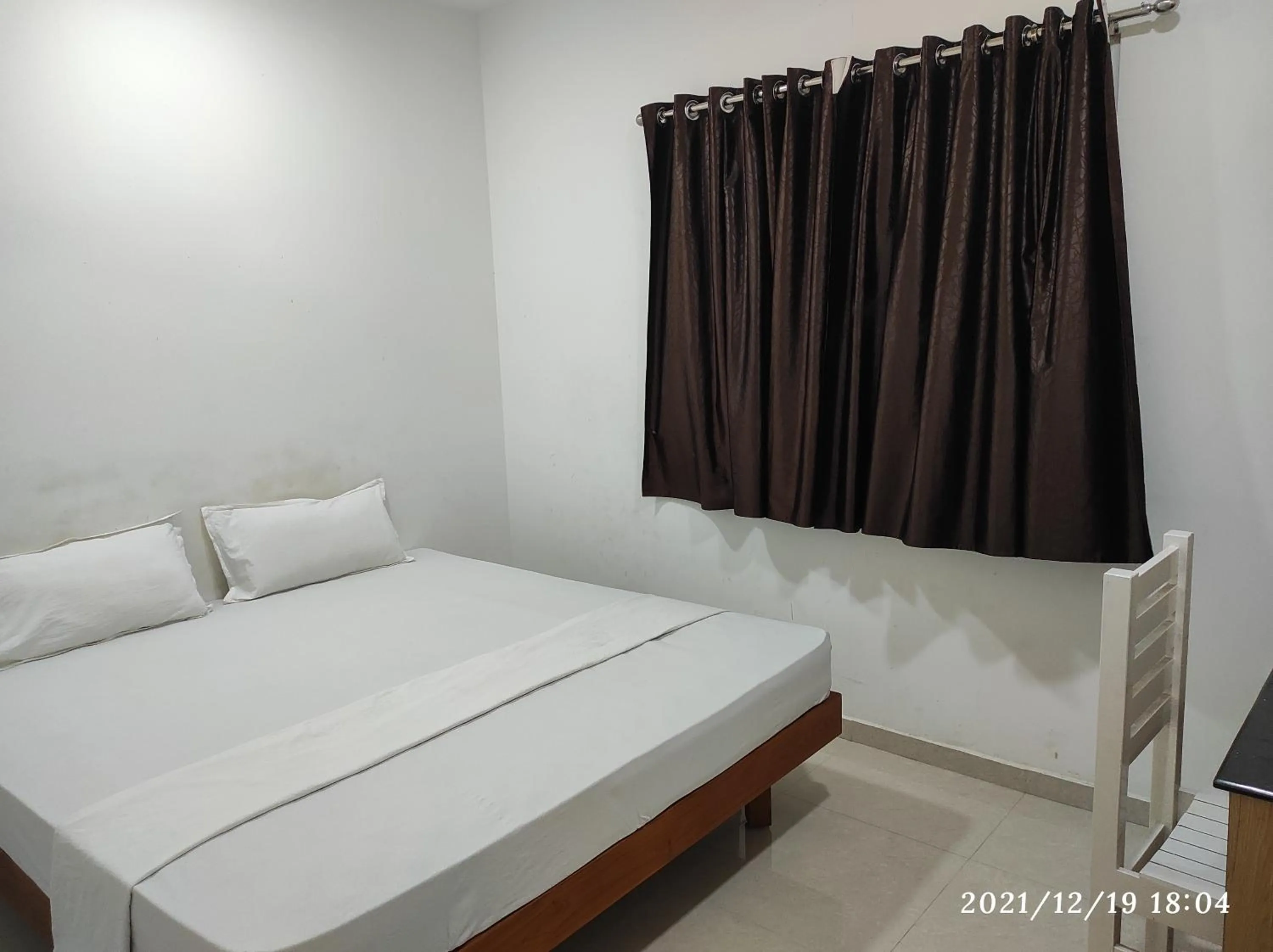 Bed in Quilon Residency