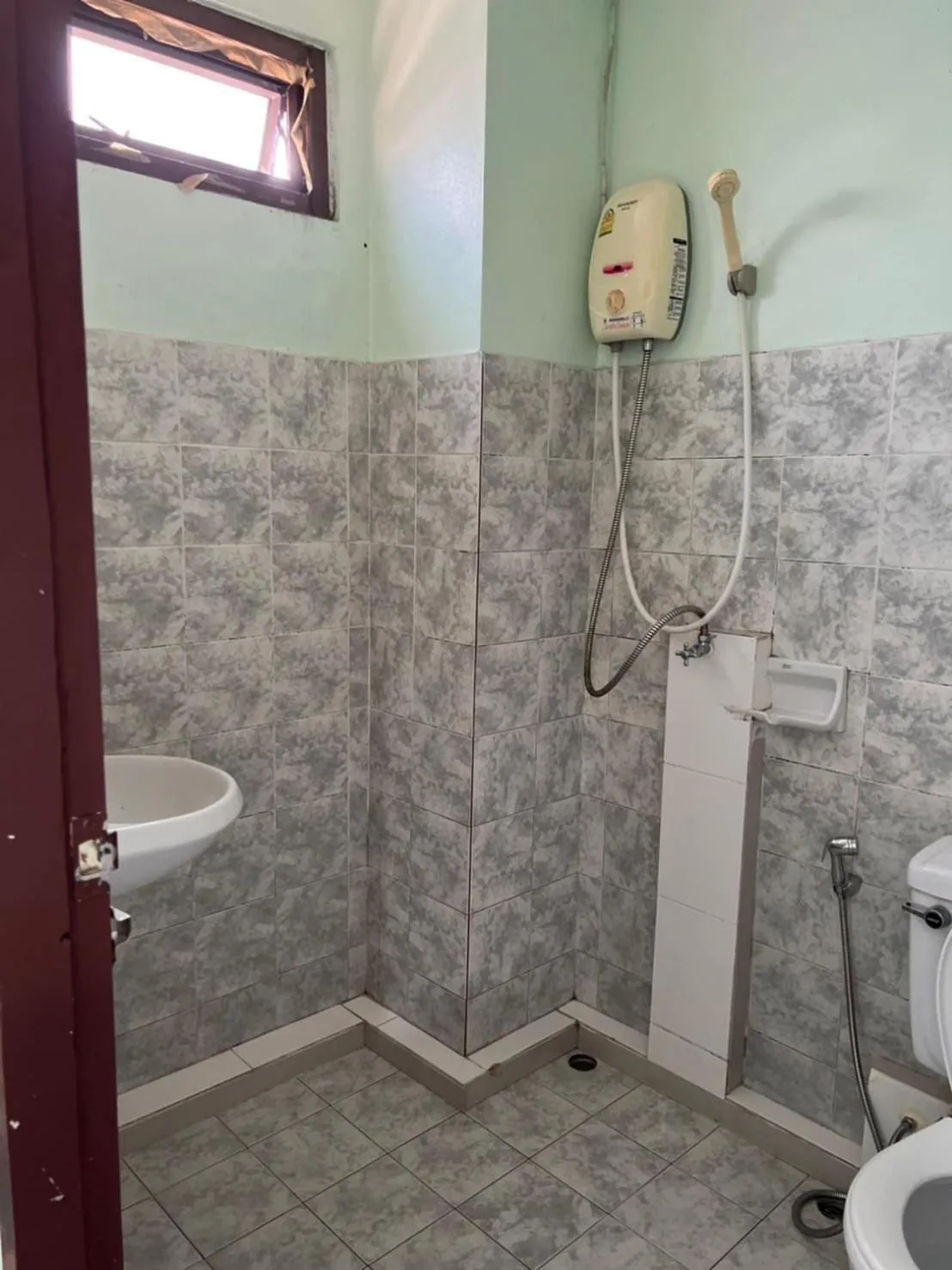 Bathroom in OYO 75377 Check In House