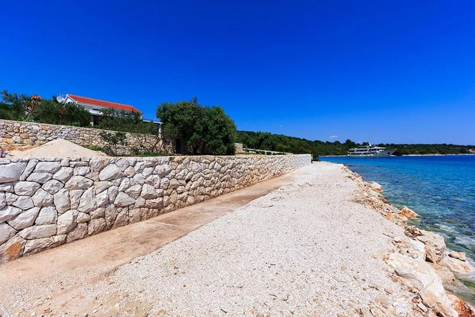 Property building in Luxury Beachfront Villa Dalmatino Trogir with private pool right at the beach in Okrug Gornji - Ciovo