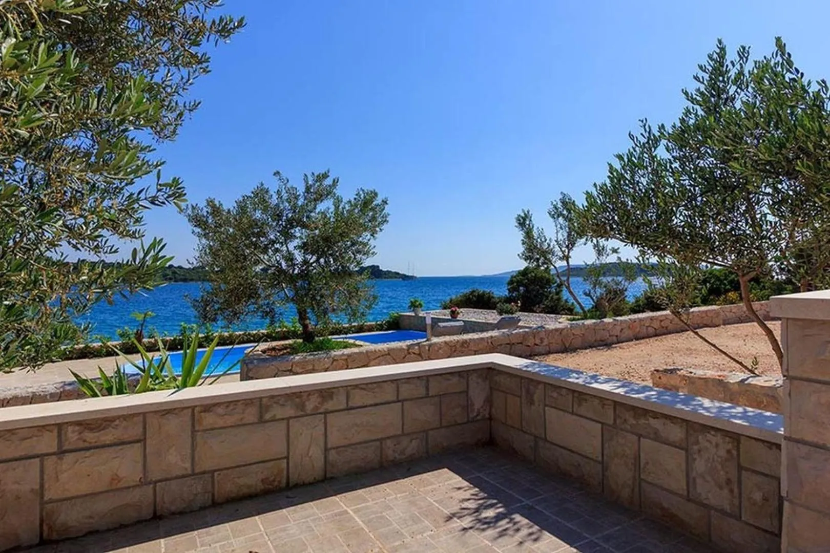 Property building in Luxury Beachfront Villa Dalmatino Trogir with private pool right at the beach in Okrug Gornji - Ciovo